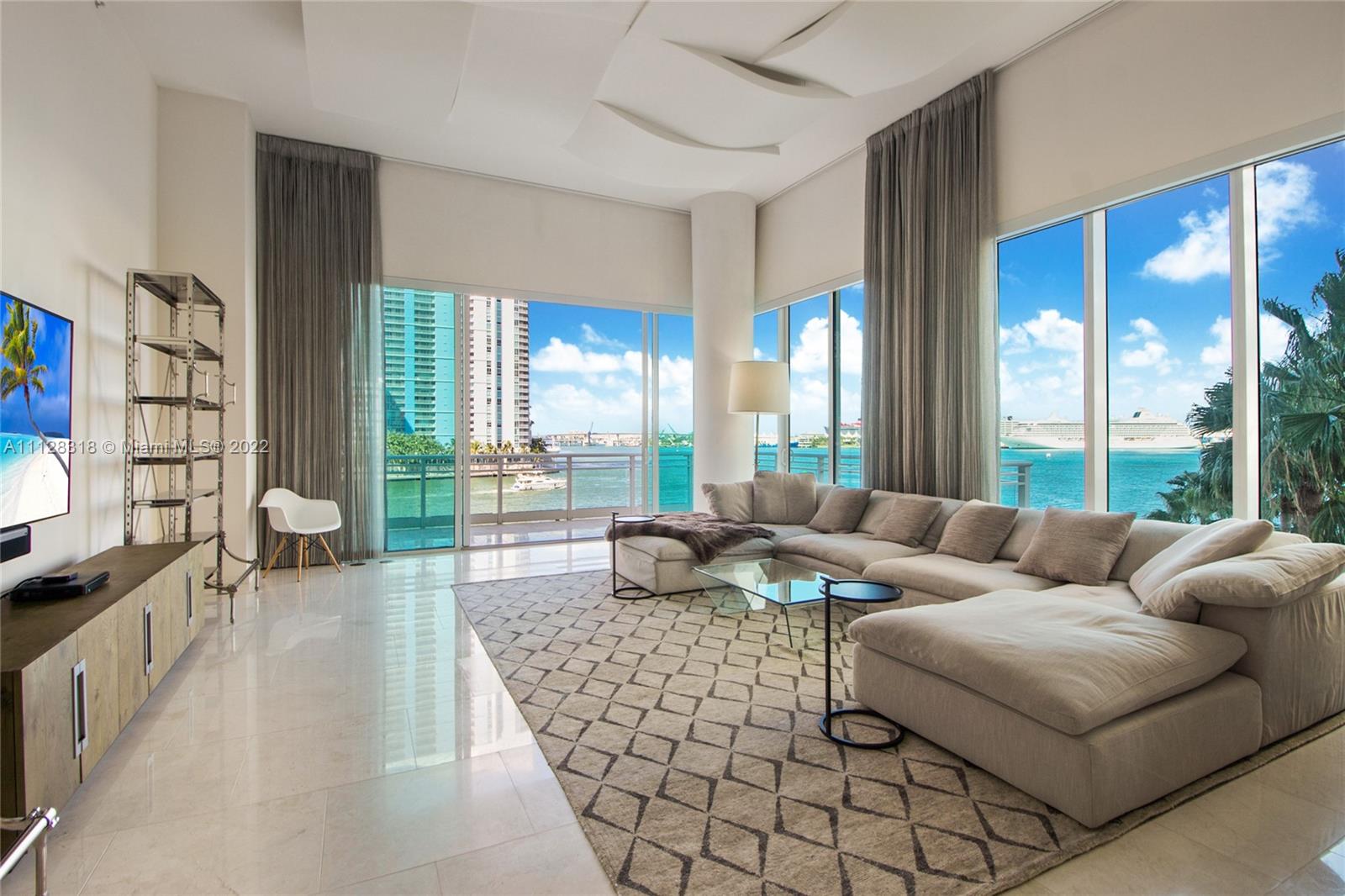 Rare opportunity to own this luxurious 2-story waterfront masterpiece which feels like a mansion floating on top of Biscayne Bay. Surrounded by turquoise water, this massive corner unit boasts over 14' ceilings, 4,631 SF of living space, 4-full/2-half bathrooms & 4-bedrooms (can convert to 5) w/ huge walk-in closets. Enjoy unobstructed views of Biscayne Bay and downtown skyline from 4 terraces w/ over 820+ SF of outdoor space. 6 parking spaces, 2 large storage units. Live the Island Life on gated Brickell Key Island & walk to everything that booming Brickell has to offer: shopping, restaurants, Brickell City Centre & more! Asia is Brickell Key's most premier building w/ 5-star amenities: 24hr gate guard & security, fitness center, pool, private tennis court, racquetball, basketball & more!