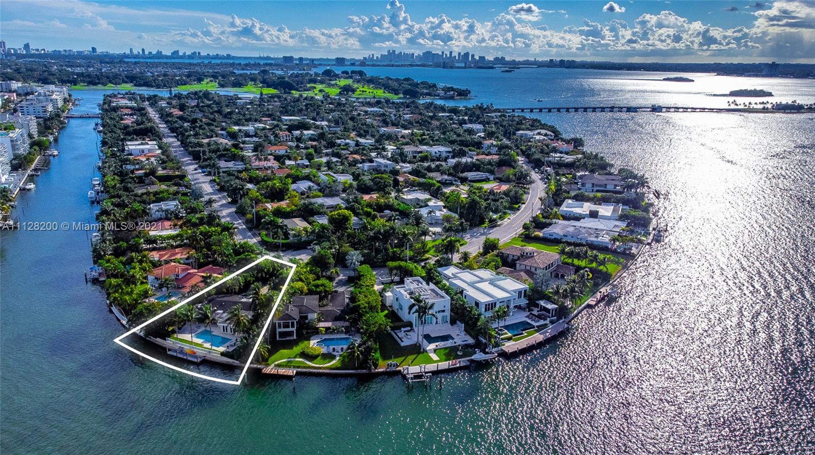 Wide bay residence on northern tip of Bay Harbor Island, situated on a 19,738 sf lot (largest waterfront lot for sale in BHI). 6bd/6.5ba + office, wonderful footprint w great bones & lots of natural light. Chefs Kitchen w Sub Zero refrigerator, Thermador double oven, 6 Burner gas stove & beverage center. Bayside pool w summer kitchen & large covered patio extending your in/outdoor entertaining areas. Travertine & oak flrs, open concept living/family/dining. All impact windows/doors, 45kw Onan full house generator. Tons of exterior storage, security cameras, +/-2003 sea wall, large dock w power for 50+ft boat, direct ocean access thru Haulover inlet within minutes. ALL you need is within walking distance: parks, Bal Harbour shops, beach, restaurants, houses of worship, schools. See video.