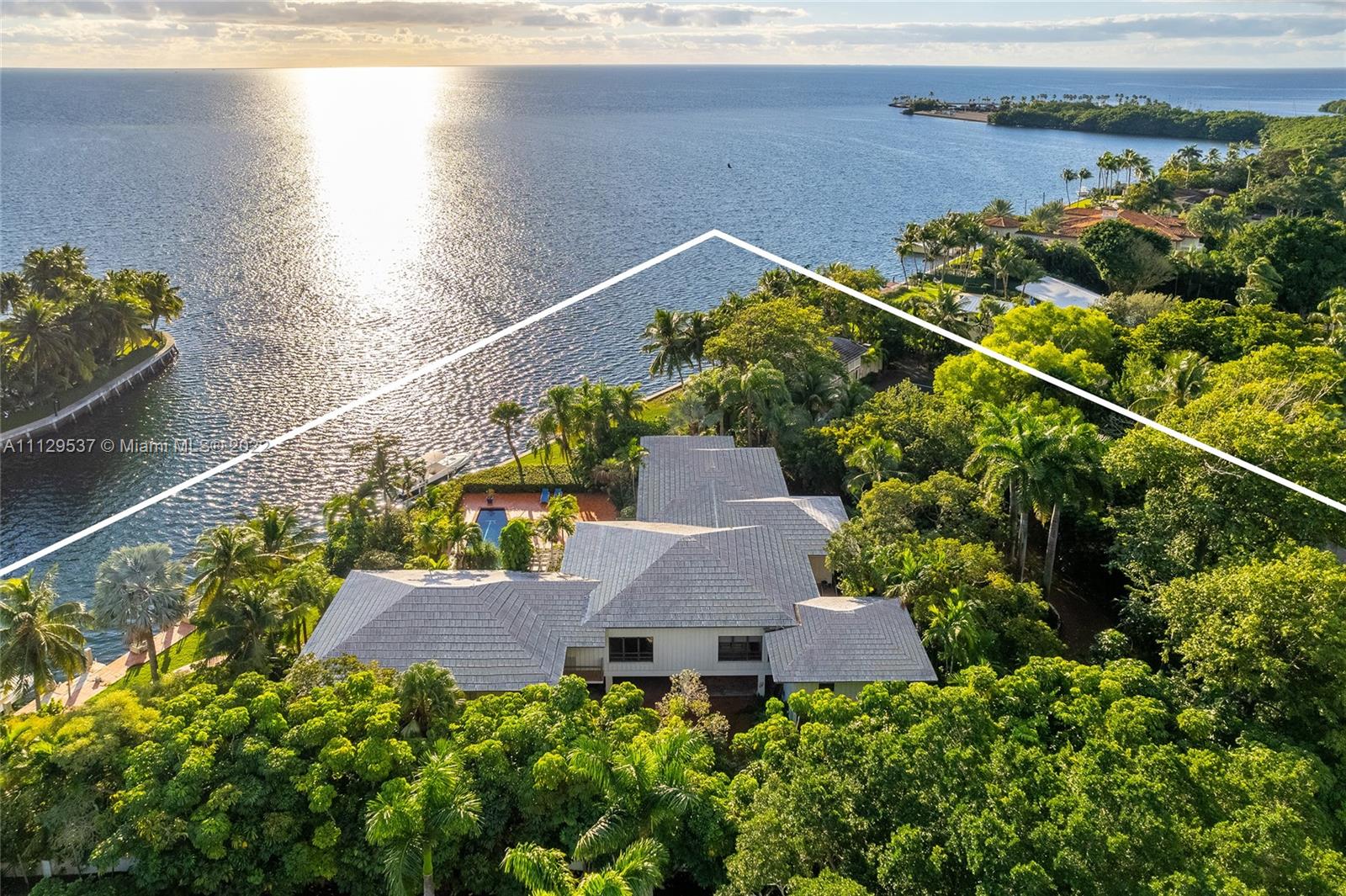 Once in a lifetime opportunity to own the largest and most exclusive waterfront lot in all of Old Cutler Bay! Build your dream home on this 1.6+ acre property which offers 390 ft of wide open bay views and direct access to the Atlantic Ocean. Sprawling estate is complete with a private tennis court and lush grounds and landscaping including stunning tall palm trees and Rainbow eucalyptus trees that allow for ultimate privacy and relaxation. The main home sits 18 feet above sea level. Enjoy views from Downtown all the way to Key Biscayne with unimpeded East views and magnificent sunrise and moonrises. Rare opportunity to develop your own custom masterpiece in one of Coral Gables’ most desirable, guard gated neighborhoods.