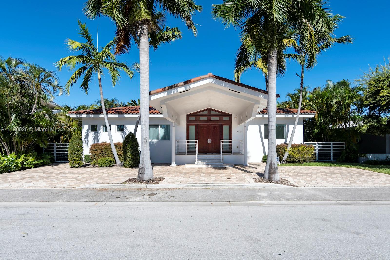 Just listed!! Very bright house with great floor plan featuring 4 bedrooms, 3.5 bathrooms + den and renovated open kitchen and top of the line appliances. Large backyard with salt water heated pool and beautiful landscaping. This house also has generator and many upgrades. Located walking distance to the beach, restaurants, A+ school, and the famous Bal Harbour Shops.
