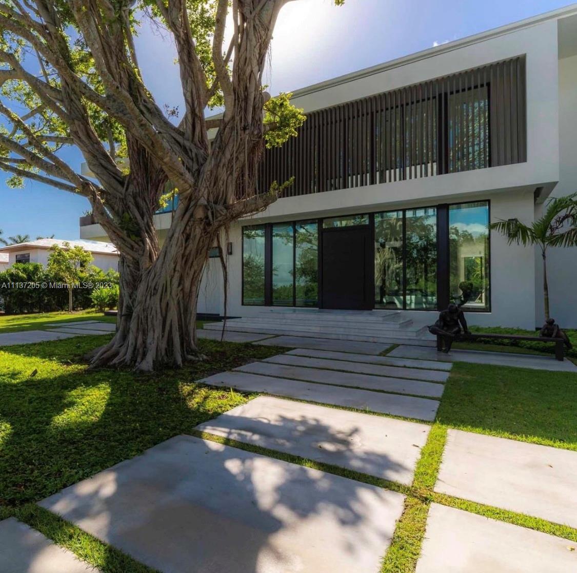 2018 New Construction built and designed modern Marvel by Hugo Mijares, G3C in conjunction with Lucrecia Lindemann Luxury...Located in the one and only coveted "Gables Estates". Water view on both sides of estate. Boasts 12,292 interior space on a acre plus lot. No detail spared. 8 Bd/ 7 Bth 1 Half bath  12,437 SqFt Liv Area,15,073 Adj Area SF,4 car garage 42k sqft Lot with water on both sides. NE Exposure.  A natural curtain of lush tropical trees surrounds the site, while its slightly slopping terrain offering an ideal location for the house itself inbetween a canal and a open bay .Retractable glass panels on the pool-facing side dramatically open up the house to the outside, while also being mindful of the need for privacy.Series of Courtyards brings lights&vegetation inside the house.