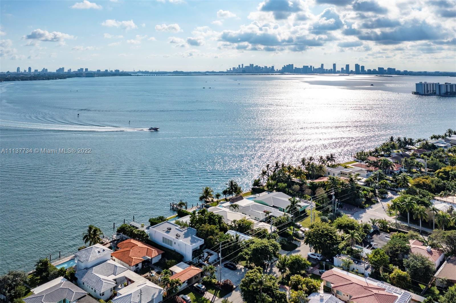 This classic Normandy Isles home offers spectacular southern panoramic views of Biscayne Bay, Miami Beach, and Downtown Miami, at an angle that allows you to take in sunrises and sunsets in equal delight - a truly special perspective for a Miami Beach property. Built in 1950, the three-bedroom, two-bath house features midcentury modern details such as a magnificent bow-windowed living space, an iconic kidney bean-shaped swimming pool and a large dock. The 2,709 square foot house also offers a two-car garage and a recently updated kitchen, and sits on an 8,770 square foot lot, with room to expand or build anew.