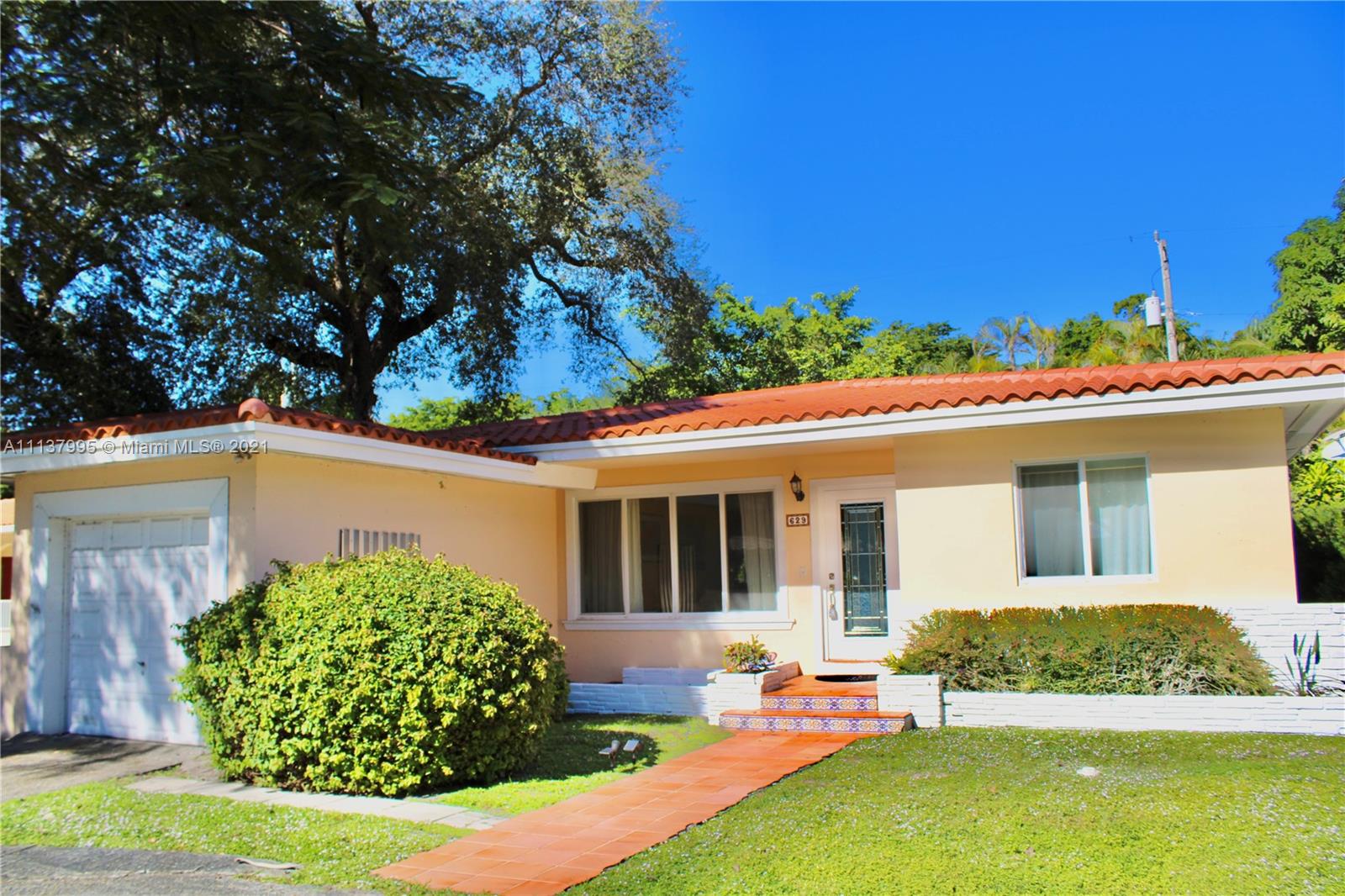 Mid Century Modern, located in The Coral Gables Country Club Subdivision. Spacious 3/2 with New roof and Impact Windows and doors. Beautiful hardwood floors with a spacious floor plan. A great room ideal for all occasions & full of light. A tree-filled patio area ready for grilling or lounging. Close to Merrick Place the University of Miami and   Miracle Mile. Centrally located to all of the venues Miami Has to offer.