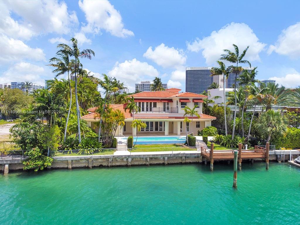 Unique opportunity to purchase the lowest priced waterfront property in the exclusive guard gated community of Bal Harbour Village. This home sits on a spectacular 20,000+ square foot lot with 77 ft of prime water frontage. Built in 2001; this incredible residence offers 4 Bedrooms, 6 bathrooms + detached 2 car garage and extremely rare full guest house suite. Additional features include library, office, patio, pool, jacuzzi, summer kitchen, garden, waterfront deck and more. Modernize this unique property and make it your dream home! Walking distance to the Bal Harbour Shops, 5-Star hotels, Beaches, Houses of Worship and much more.