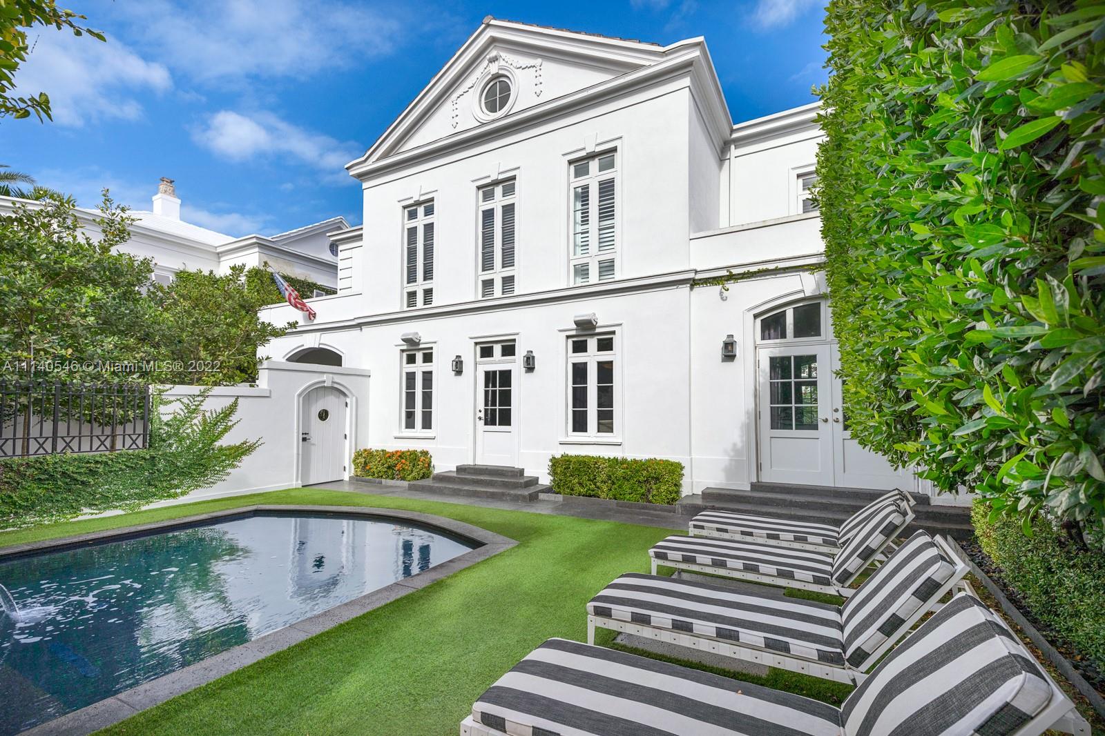 The epitome of chic, this landmark home located in the historic French City Village of Coral Gables features 4 beds + 4.5 baths. Designed by Angelo Rodriguez of Angelo Gerard Group this bold yet quaint home has vivid designs throughout. Complete with substantial renovation, the formal dining encompasses art deco vibes, the living includes an avignon quartzite fireplace and wall coverings by Ralph Lauren Elitis and Contarini. The custom bar is topped with nero marquina marble . The eat-in kitchen is finished with brown Egeo marble, Waterworks hardware, Wolf oven, Bosch, and Subzero appliances. The primary bath is complete with centaurus onyx & walls of zebrino white marble and dual walk-in closets. The arched French doors open to a beautiful courtyard with a pool and black lava stone floors