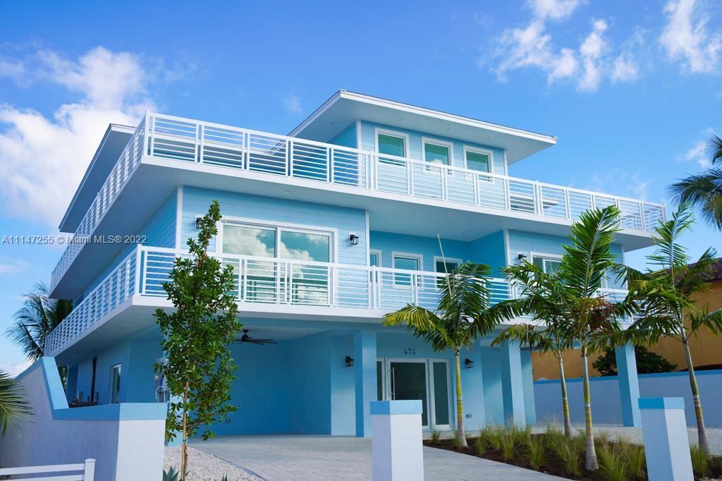 Amazing New construction on Key Largo, only 750 sq feet. Owner will financing with a good down payment. Bright, light and coastal throughout with a real ''Florida Keys'' feeling! This home is the dream home in the keys with no details spared! Italian Tile floors, 7 Bathrooms with Italian Porcelain tiles with customs made showers glass doors, 7 Bedrooms in total with 2 master bedrooms, pool with jacuzzi surrounded with artificial grass. LED lights in the entire property , Marble tiles on the stairs, Italian bath up on the Master Bathroom, Custom made kitchen with Quartz counter top and glass range, 75 feet of boat dock with a 25 feet deep canal for your boat, canal has an exit to the ocean. Elevator to access the 2nd and 3rd floors. Driveway are made of Hydro pavers imported from Germany.