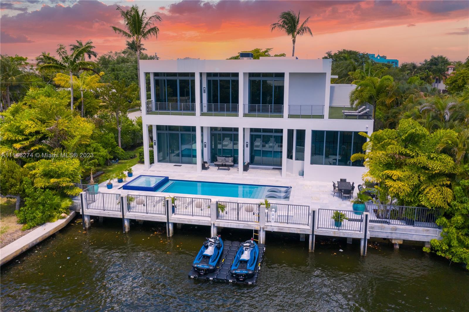 This unique and impeccably designed home is sure to leave you in awe. Enter this vast open-floor plan and step out to 100ft of yacht friendly frontage and oasis. Gourmet kitchen, generous master-suite & master-bath, with amazing intracoastal views. Just minutes to fine dining, shopping and the beach. This home rents for 100k+ monthly, and comes fully equipped with a vacation rental license. Call agent for exclusive showings.