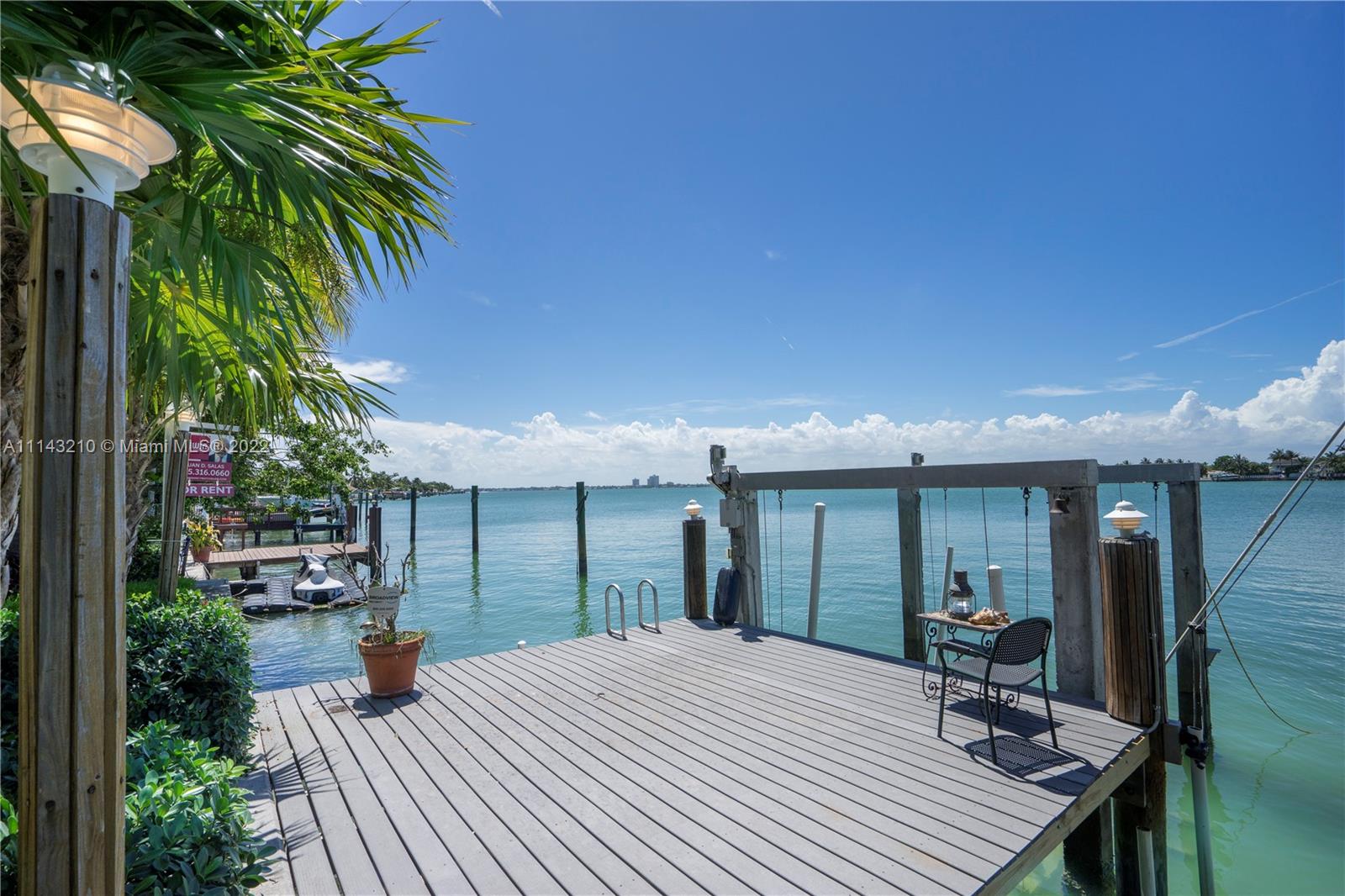 Guard gated Biscayne Point Island. Live in or Tear down and build on this 11,250 Open Bay Waterfront lot. No bridges. House is completely remodeled, spacious open living, dining & family rooms with wide bay views. A large updated, brand new, eat-in kitchen features SS appliances & double sink. Four comfortable bedrooms, one private with separate entry, waterfront master overlooks freeform pool, dock with boat lift. Impact windows, Updated baths. One car garage. Rent property while getting permits for New Construction. Please read broker remarks.