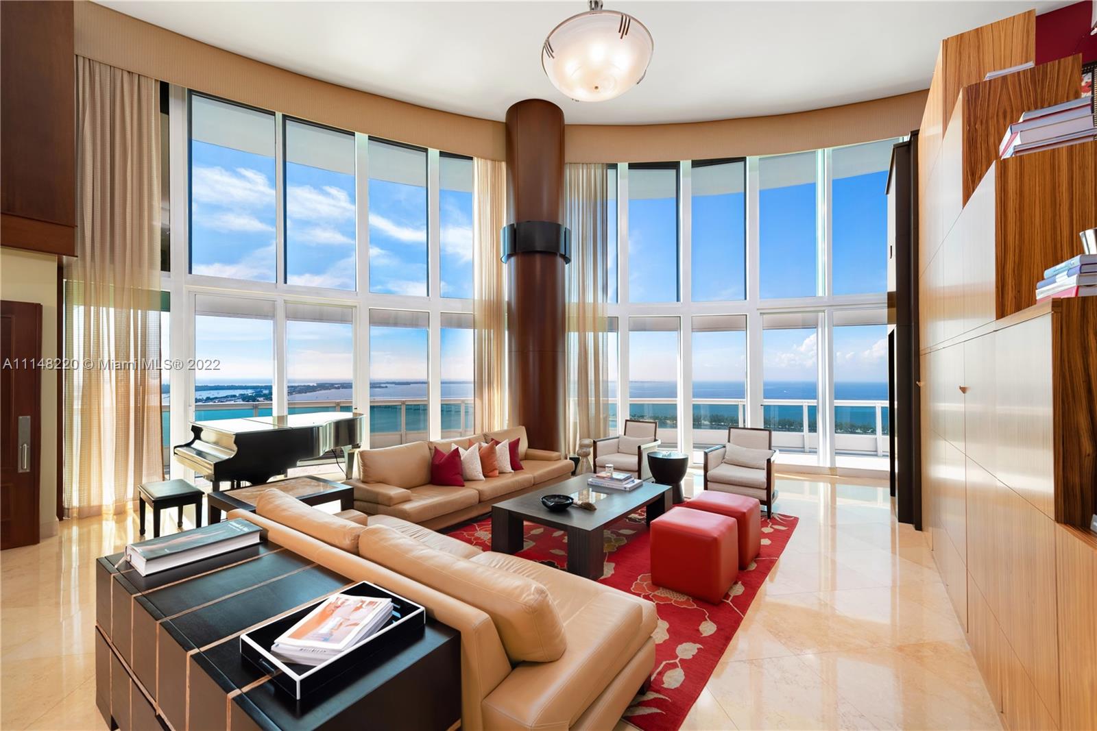 This home in the sky at the exclusive Santa Maria building features 5,733 sqft + 1742 sqft of expansive terraces with unobstructed views of the Ocean, Bay and Miami Skyline. Flow-through 2 story unit features a private foyer, soaring 20ft ceilings, solid mahogany doors, and electric shutters. This home has a custom sound proof theater and all blackout electric blinds. Amenities include state of the art fitness center, tennis court, pool, spa & Storage.