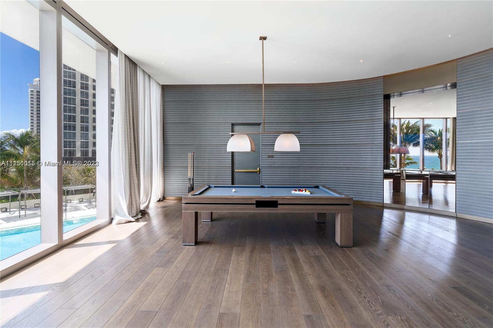 pool room overlooking pool and ocean