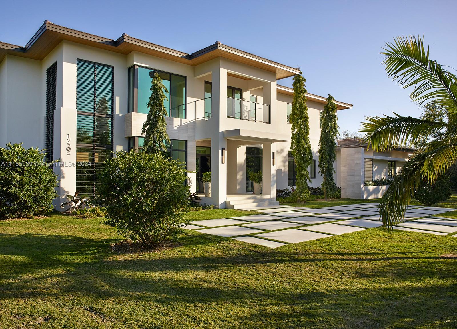 Stunning California modern  new construction by award winning Hollub Homes, nestled on an idyllic Pinecrest street w/ a perfect blend of timeless sophistication and legendary quality. The extraordinary design, expansive floor plan  and luxurious finishes combine  to create the perfect S. FL retreat, featuring 7 bedrooms, 8 baths (including guest house) 5 car garage! Wonderful indoor and outdoor entertaining areas with bar and wine. Soaring ceilings, floor-to-ceiling glass, designer finishes. Gourmet dream kitchen with Wolf/Sub-Zero. Grand primary suite; flex spaces for media, gym, office; upstairs loft; elevator.   Resort style patio  w/cabana & summer kitchen.  Fabulous 973 SF guest house.  Generator.  Completion: Summer 2023