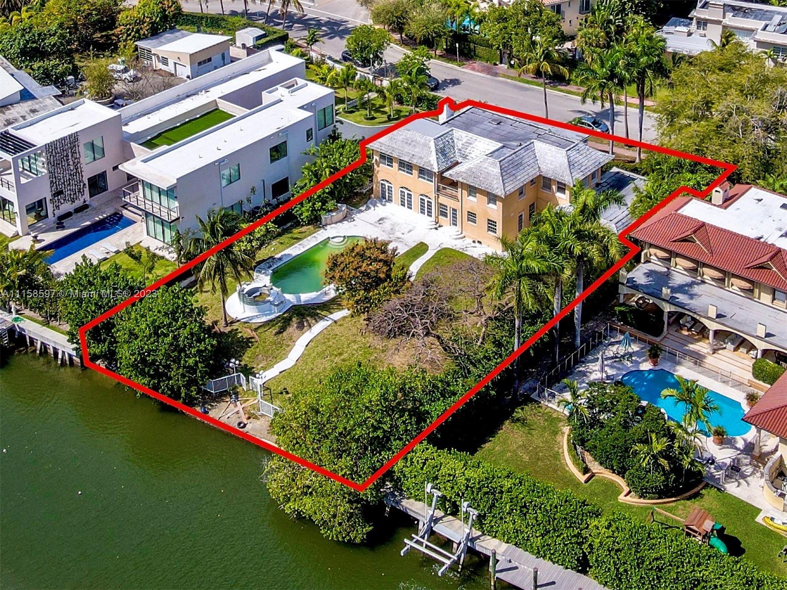 REDUCED!!!! Build up tp 9,500sf waterfront dream mansion or remodel the existing house on this rare to find huge 19,979 square feet lot with 100 ft waterfront on Flamingo Drive, one of the most peaceful and luxurious Miami Beach street.