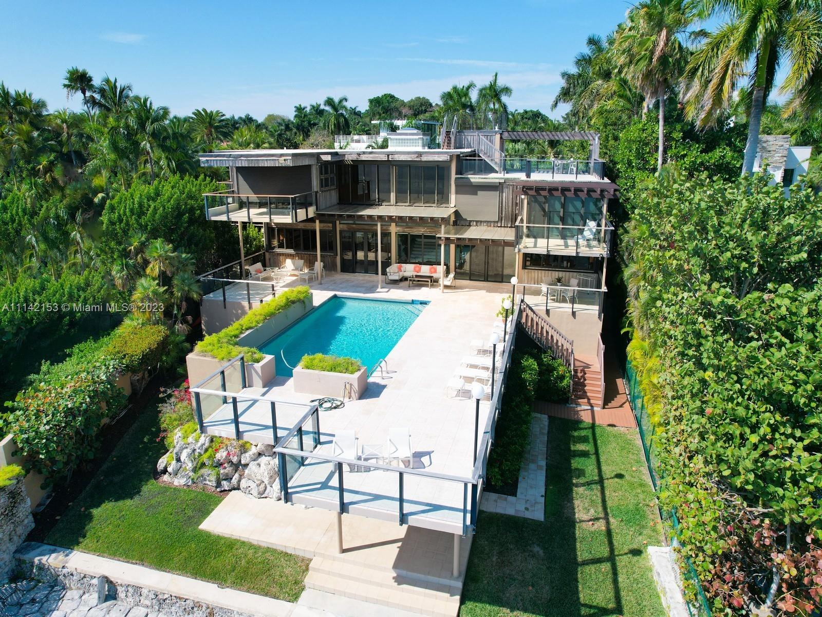 POOL DECK AND BACK OF THE HOME