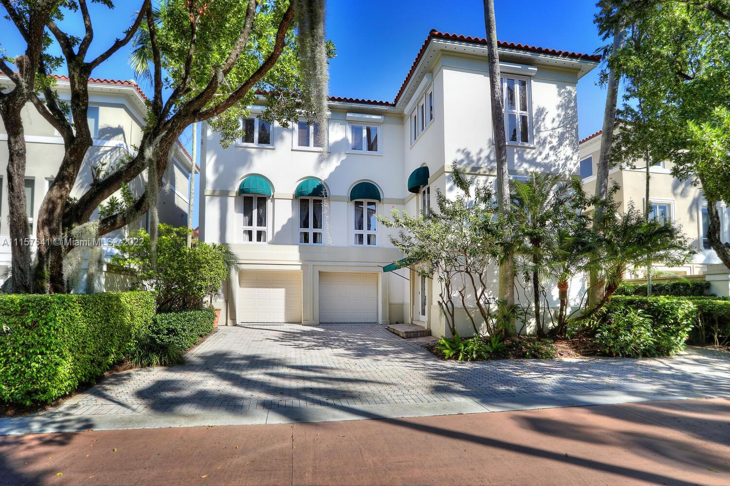 "Bayshore Villas" is an exceptional, guard-gated community in Coconut Grove with twenty-five villas on an oak lined private street.  This home has three floors with an elevator and an oversized garage. On the first level you will find a full bedroom and bath. The hallway takes you to a lovely private patio. The main level has a flexible layout, with a living room, family room and dining area.  The kitchen has an island and a separate breakfast room and top level includes the primary bedroom and two bedrooms, each with their own baths.  Amenities include tennis courts, pool and spa, and access to sunrises on Biscayne Bay. From time to time dock space is available. Walk to parks and yacht clubs!