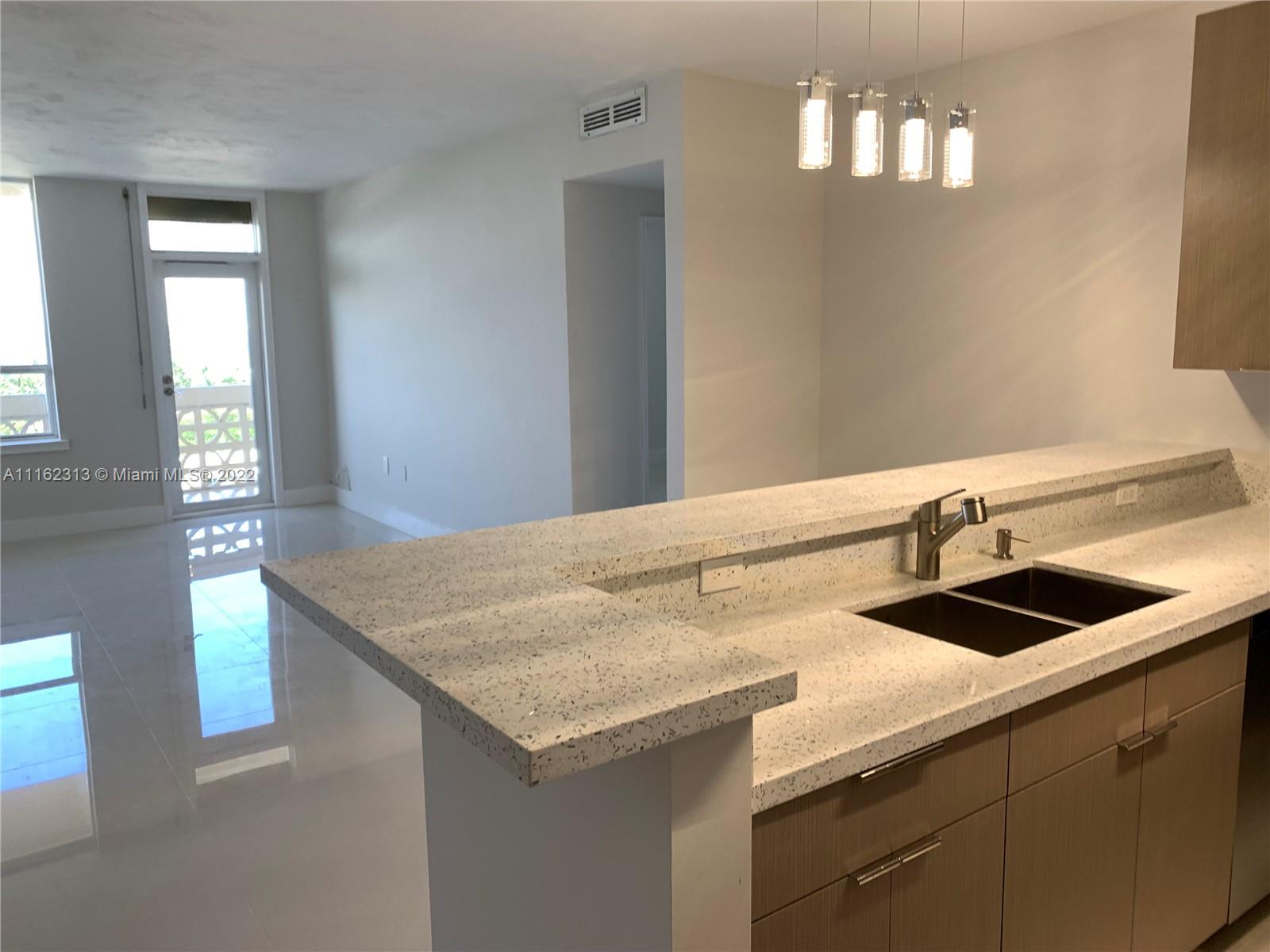 Completely renovated unit in an oceanfront building in Bal Harbor. 1 bedroom + den that can easily be used as a 2nd bedroom w/ 2 full bath. The unit was remodeled from top to bottom with all fine luxury finishes, which include a made to order designer kitchen cabinetry with fashionable stone countertops, stainless steel appliances, Moet faucets. The master bed has a master bath fitted with a Toto toilet/bidet and oversized shower which includes state of the art fixtures. The 2nd bathroom has a tub. Gorgeous porcelain floors. Expensive light fixtures. This line has largest balcony. There are so many lovely features, but nothing compares to the breathtaking lovely sunset views. OWNER FINANCING AVAILABLE! The last 1 bedroom/Den sold in the Plaza went for $620,000. Dont miss this opportunity.