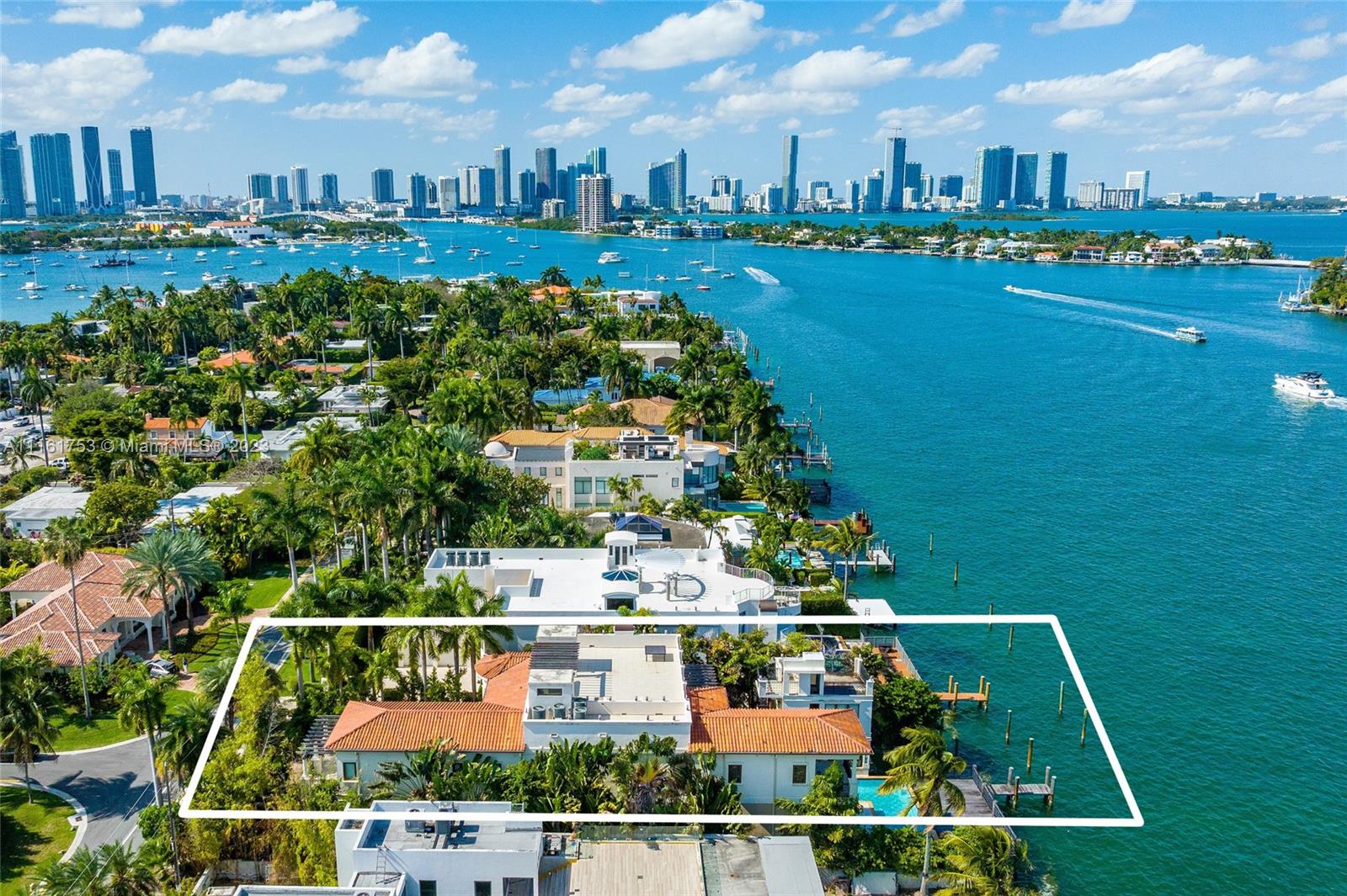 Enjoy waterfront living overlooking the waters of pristine Biscayne Bay in this 3-story private, gated home located within exclusive Hibiscus Island. Facing North w/ open waterways & 70’ of waterfrontage, this home is a boater’s paradise w/ a private dock to fit your yacht. The home boasts volume ceilings, oversized impact windows/doors, multiple private balconies, a completely detached guesthouse overlooking the water, 2 car garage & a 1,200 SF private rooftop terrace w/ spectacular views of Biscayne Bay, the Downtown Miami Skyline & Port of Miami. Live on an island in the middle of the city. Hibiscus Island offers a waterfront park, tennis & basketball courts, playgrounds, 24 hour manned police officer at the main entrance, all within a short distance of the best Miami has to offer