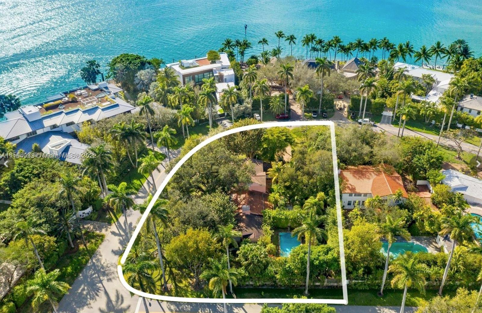 Rare opportunity to live on exclusive, guard gated LA GORCE ISLAND! Build your dream home on this 25,896-SF CORNER property with majestic oak trees; one of the best and largest dry lots on the island. You can build an over 10,000-SF home and still have substantial land for ultimate privacy. La Gorce Island offers a tranquil, private setting amongst beautifully landscaped streets. Enjoy 24-hour security, a gated entrance, and marine patrol. Minutes to Indian Creek Country Club, La Gorce Country Club, Bal Harbor, South Beach, and the ocean. Current house being sold AS-IS. Lot SF is as per survey. Renderings and plans available for a new home with architecture by Kobi Karp