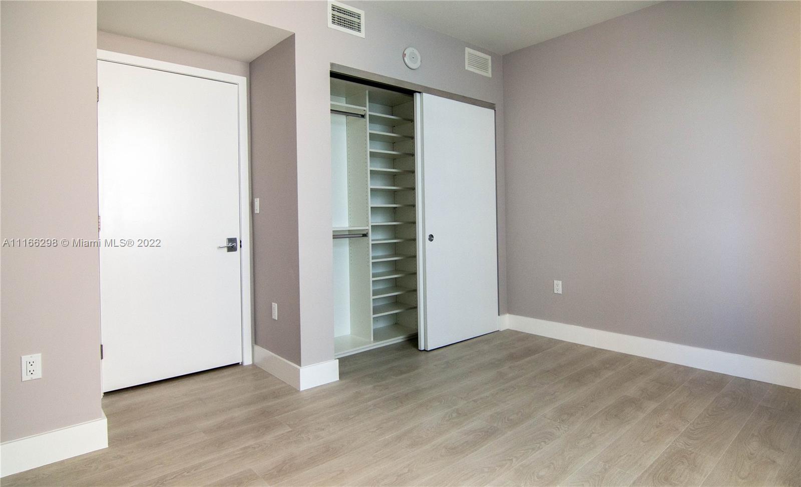 Bedroom Number 2 with a Closet and - private bathroom / bathtub. Facing North. Partial water view.