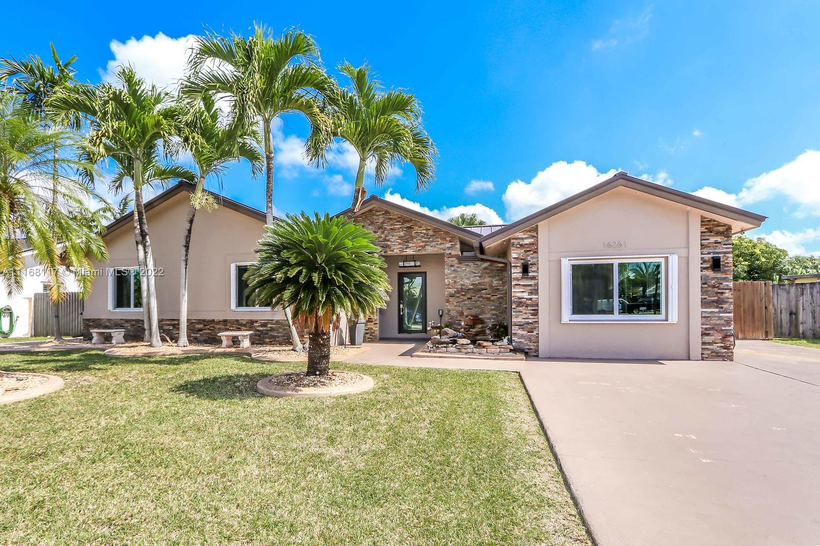 SPECTACULAR RANCH STYLE HOME WITH GREAT CURB APPEAL! THIS HOME HAS BEEN TASTEFULLY UPDATED INSIDE & OUT.  IMMACULATE ENTRANCE W/ FOUNTAIN , BRICK ARCHITECTURE, & BEAUTIFUL LANDSCAPING.  FEATURING TILE FLOORS THROUGHOUT, LARGE OPEN KITCHEN W/ WOOD CABINETS, GRANITE COUNTERS, STAINLESS STEELE APPLIANCES, 2 OVENS, PLENTY OF CABINET STORAGE & BUILT IN BAR.  OPEN UP YOUR FRENCH DOORS TO THE PATIO, POOL DECK & HEATED POOL WHICH IS GREAT FOR ENTERTAINING! BACKYARD IS COMPLETELY FENCED IN. THIS HOME ALSO OFFERS AN ENCLOSED GARAGE WHICH CAN BE AN EXTRA BEDROOM OR DEN. COMPLETE W/ IMPACT WINDWS & ACCORDIAN SHUTTERS FOR EXTRA PROTECTION, NEW METAL ROOF, W/ ENTIRE PERIMETER LIGHTING, RAIN GUTTERS, PARTIALLY COVERED TERRACE, SIDE GATES FOR YOUR BOAT OR RV INCLUDING 30 AMP OUTLETS & PLENTY OF PARKING.