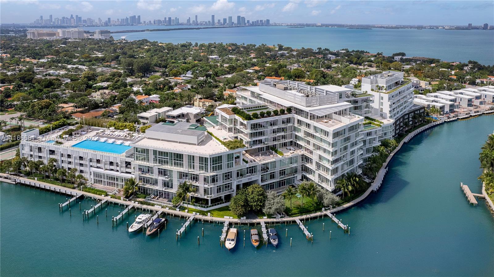 A quiet, lakeside community, waterfront gardens, rooftop pool, and 36 boat slips.  This 4255 Square foot, 4 bed 4.5 bath was built for entertaining. With an expansive open floorplan. Enter the home through your private elevator foyer. Owners are greeted with a grand kitchen that serves as the home’s hearth. Pierro Lissoni designed Boffi Kitchen with Expansive stone countertops Gaggenau Appliance Suite including: freezer, gas cooktop, microwave oven, stainless-steel wall oven, full-size dishwasher and built-in coffee maker Zucchetti plumbing fixtures, master suite w/ Designer Boffi bathrooms by Lissoni with Zucchetti fixtures accented with Stone floors and walls. The rest you have to see. A dedicated staff and elite concierge are at the heart of this community. RARELY AVAILABLE!