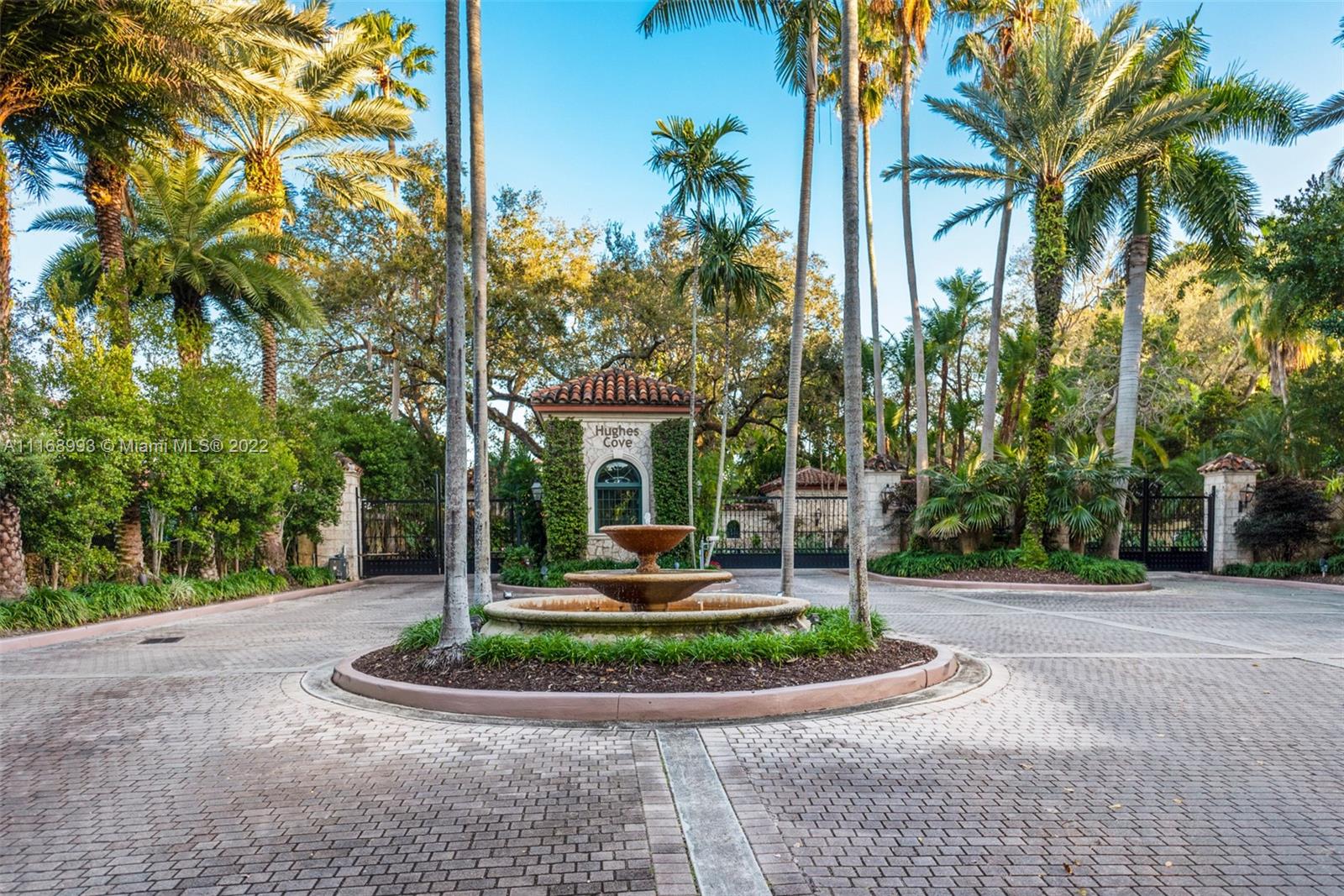 Tucked inside the prestigious, private & gated enclave of Hughes Cove, sits this stunning estate, filled w/ natural light, & boasting high ceilings throughout & gorgeous views of the waterfront park & bay across the street! Offering seclusion & elegance w/ room for everyone, this 9,862 sqft, 7 bedroom, 10 bathroom home has a terrific layout for families w/ 5BD/5BA on the 2nd floor & a media room & laundry room! Enjoy expansive balconies, covered terraces, a 2 car garage + carport, summer kitchen, elevator, gourmet gas eat-in kitchen, heated pool, gym, library, his & hers primary baths, playrooms, & rooftop terrace! This exclusive Coconut Grove community w/ only 11 residences, is a short walk to the village & has a 24hr security guard, tennis court, & serene privacy.