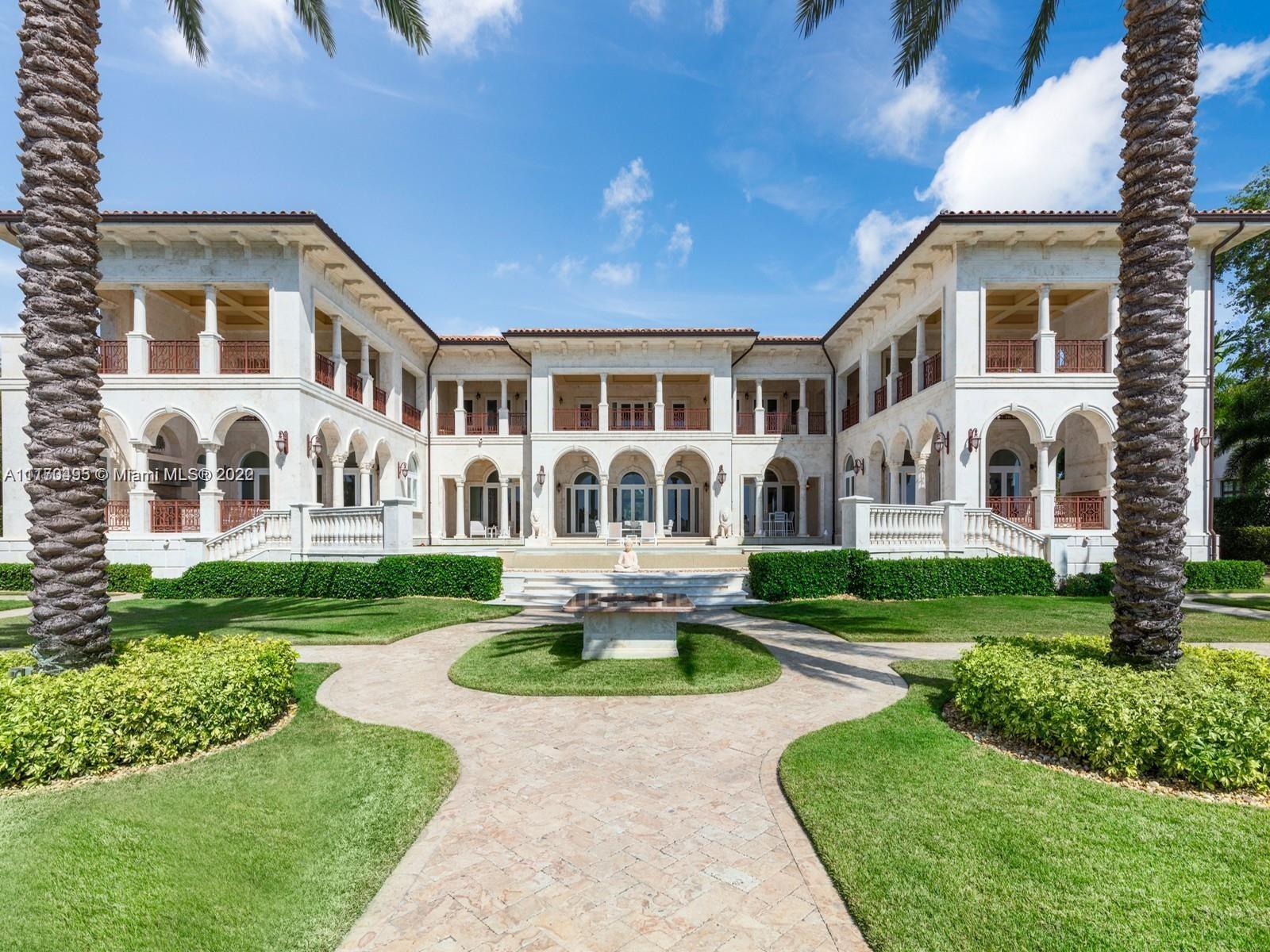 Neo-Classical Italian style villa on the widest lagoon in Gables Estates with 200 feet on the water and 140 foot dock. 8 bedrooms, 9 baths, 5 HB, library/office, gym, and 600 bottle custom wine cellar fill this 18,073 total SF palatial estate. Marble veneer walls, custom carved stone elements, & Venetian Plaster throughout. Over 4,000 SF of expansive covered terraces are ideal for entertaining. Large primary suite with his/her baths and walk in closets, custom crafted chefs kitchen open to the large family room and secondary office. Butler’s pantry and 2 bedroom staff quarter, this estate checks off all the boxes!