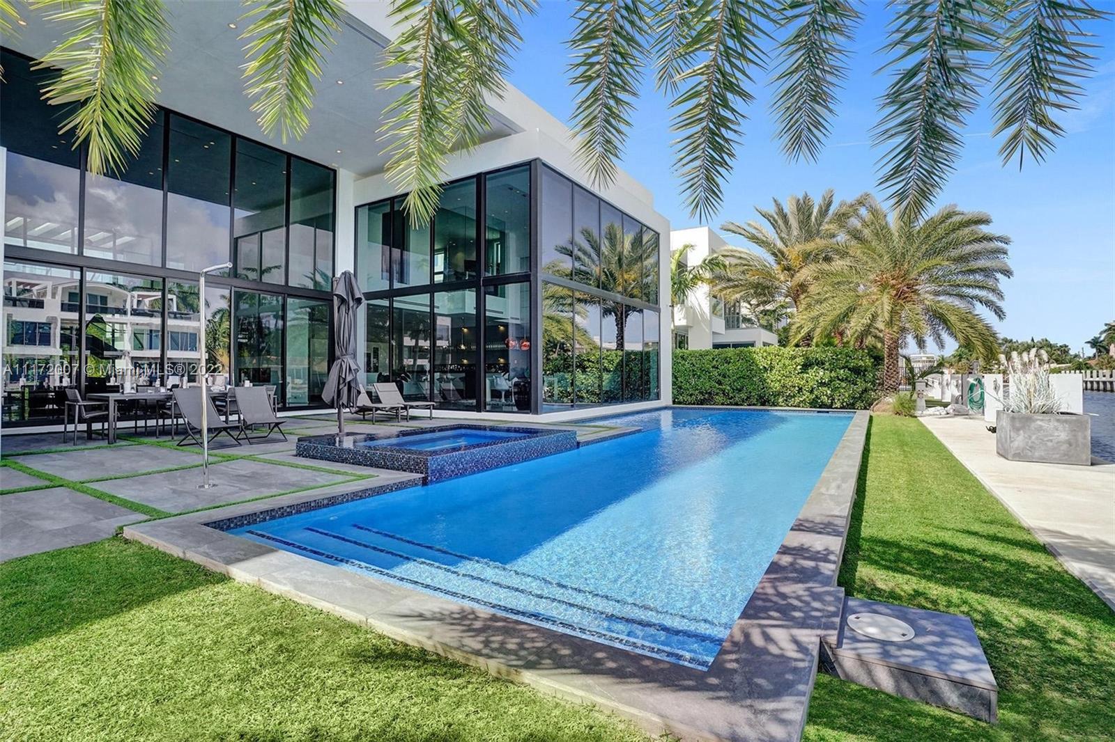 Exceptional, modern turn-key home just minutes off Las Olas Blvd.! Built in 2019 to the highest standards and exquisitely finished this residence has never been rented. A 100’ dock accommodates large yachts, no fixed bridges allow easy ocean access. The double height entry foyer leads into a great room with open bar and fireplace overlooking patio, pool and canal. Open kitchen with high end Bulthaup cabinets, Subzero and Gaggenau appliances, as well as a family room and open gym complete the ground floor. The 2nd floor features all 4 bedrooms including a spacious master suite in its own wing, with a large private balcony, walk-in closet and luxurious bath. The home’s spacious outdoor dining & lounge area with heated pool, BBQ and fire pit is perfect for enjoying lazy afternoons.