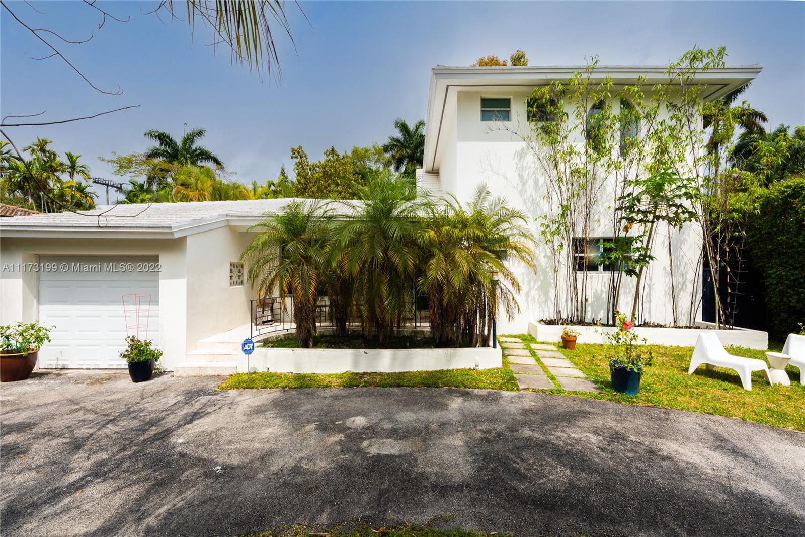 Spacious, bright and super-chic 4-bedroom 4-bath Mid-Century home surrounded by green trees and bamboo in the heart of gated Morningside, the hottest neighborhood of Miami's Upper Eastside and minutes from the Design District, Downtown, and Wynwood. Steps from a large park and Biscayne Bay. Open floorplan with wood and terrazzo flooring, designer Italian kitchen and high-end appliances for entertaining in style. Lots of impact windows unite interior and exterior. Two master suites, bonus room could be fifth bedroom, prep kitchen, office. Smashing upstairs master suite with park and bay views, luxurious spa-like bath.