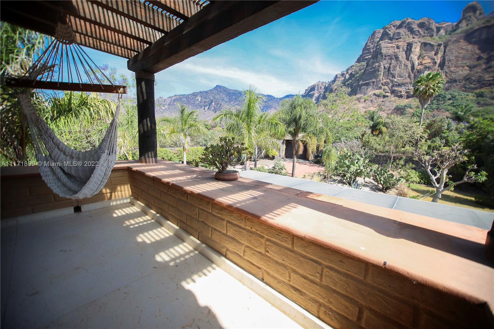 Terrace with Stunning panoramic view of the mountain, pool & garden.