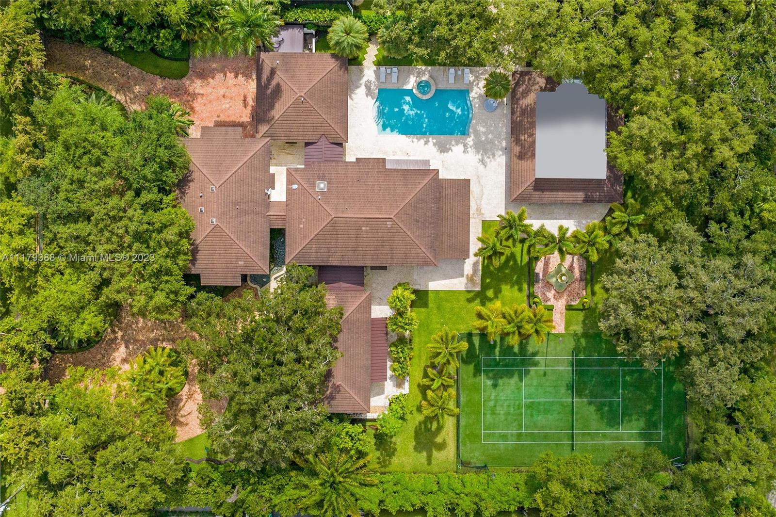 A rarely available 1.5 +/-acre property in the much sought-after Ponce Davis area presents an ideal opportunity for luxurious family living. This 7 bedroom , 8 full baths and 2 half bath property has not only a main house, but two additional properties on this estate: a guest house/ pool cabana and a large recreational house, complete with full bath, summer kitchen and an expansive covered patio for large scale entertaining. Perfectly sited to the side of the property is a lighted tennis court, providing the perfect location for a family’s tennis enthusiasts. The main house has not only two master suites, one on the ground level and one on the second level, but it also includes an expansive family room overlooking the pool and tennis court, a spectacular kitchen and much more.