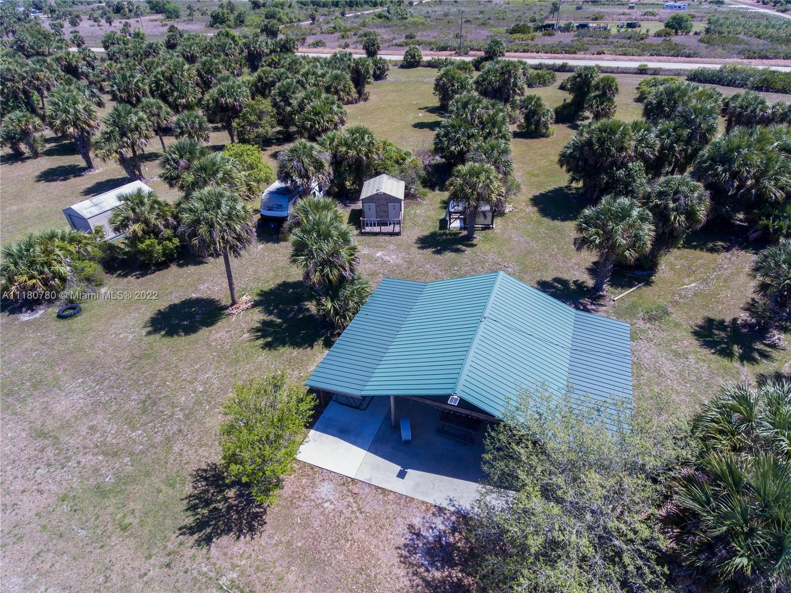 Aerial showing outdoor kitchen, bathrooms and shed