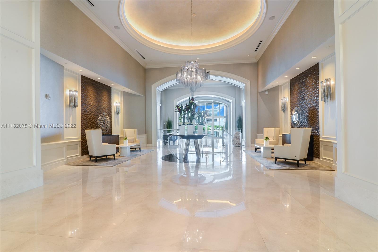 Step off your private elevator and enter the foyer of this magnificent 3 bedroom, 3 bath apartment that has been lovingly cared for and updated by original owner. Enjoy the sunrise over the intracoastal and ocean, and the sunset from the master bedroom balcony. The spacious living area also has a renovated media room with decorator custom built-ins and wall decor. Marble and porcelain tile floors, the gourmet kitchen has been opened with breakfast bar, new appliances and leather granite counters. Guest bath was recently renovated, as well the serene master suite enjoys quiet times with the quiet rock that was installed. The oversized laundry room has access from the condo, with lots of storage. Also included are three owned parking spots, plus additional parking with Valet.