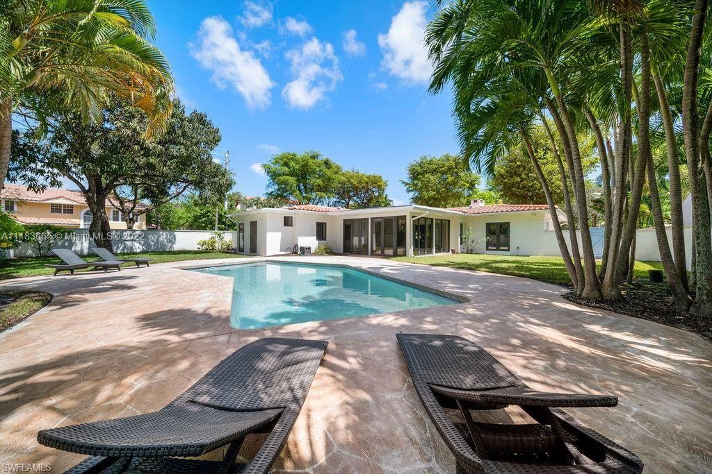 Quintessential VICTORIA PARK MID-CENTURY MODERN on "double" CORNER LOT. UPGRADES GALORE: IMPACT GLASS HURRICANE WINDOWS & DOORS, NEW SANIBEL GLAZED BARREL TILE ROOF 2020-2021. NEW GUTTERS 2021. NEW INTERIOR PAINTING 2022. EXTERIOR Pressure washing 2022. NEW POOL HEATER and NEW POOL LIGHT 2021. PORCELAIN & WOOD FLOORS, PLANTATION SHUTTERS, VESSEL SINKS, SS APPLIANCES, AUTO ROLL SHADES, FIREPLACE, CONCRETE PRIVACY WALL on 3 sides enclosing huge resort pool & cabana bathroom. ONLY ONE NEIGHBOR SIDELINE. REAR ALLEY behind the home adds additional PRIVACY and AIR SPACE. Attached single-car garage plus TWO DRIVEWAYS to accommodate up to 5 vehicles. Great ENTERTAINING starts at the front door OPEN PORCH area to celebrate the holidays TAKE THE PLUNGE TODAY. EXCELLENT INCOME POTENTIAL B&B/VRBO.