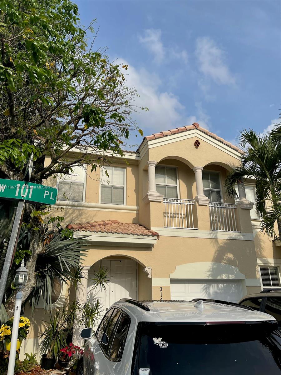 Excellent two story townhouse with 2 bedroom, 2.5 bathroom & 1 car garage built 1999, in one of the best keep
secret in Doral. Conner unit in quiet site of the neighborhood & great location. Minutes to great schools, 
Tile floor & laminate upstairs. NO carpet! Low HOA fee includes: cable, landscaping, gate
community. All bedrooms are upstairs with an open downstairs living area. Spacious master bedroom has a walk
in closet, large bathroom with dual vanity, roman bathtub & walk in shower. High quality construction with
hurricane shutters in all windows & doors!! Great location! EASY TO SHOW!