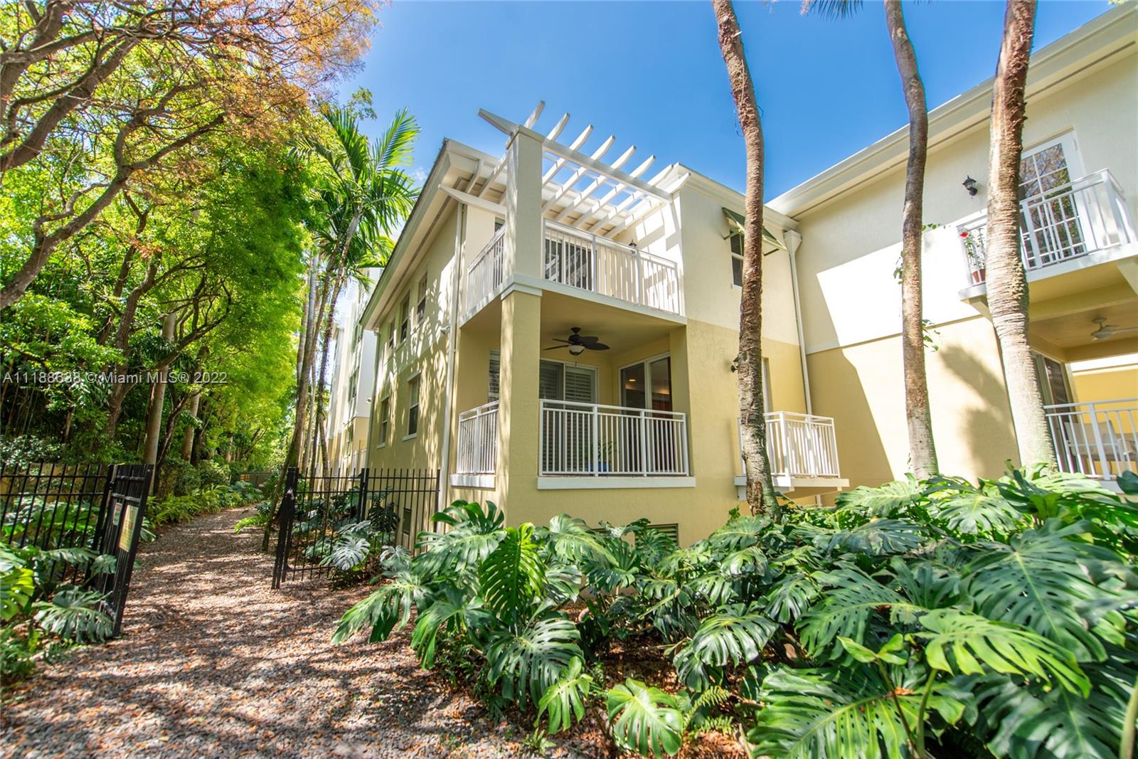 Great opportunity to live in the heart of Pinecrest! This rarely available ground floor & corner 2-story unit is located in the highly desirable Reserve of Pinecrest. This serene 3 bedroom/ 3 bathroom offers a great layout & two balconies with lovely treetop views.  Updated eat-in kitchen, wood floors in bedrooms, hurricane impact windows, and lots of storage. 1 bedroom on ground level and Master Bedroom en-suite on 2nd floor. Wonderful amenities include gym, pool, and 2 assigned parking spaces in garage. Located within Pinecrest Elementary school district.