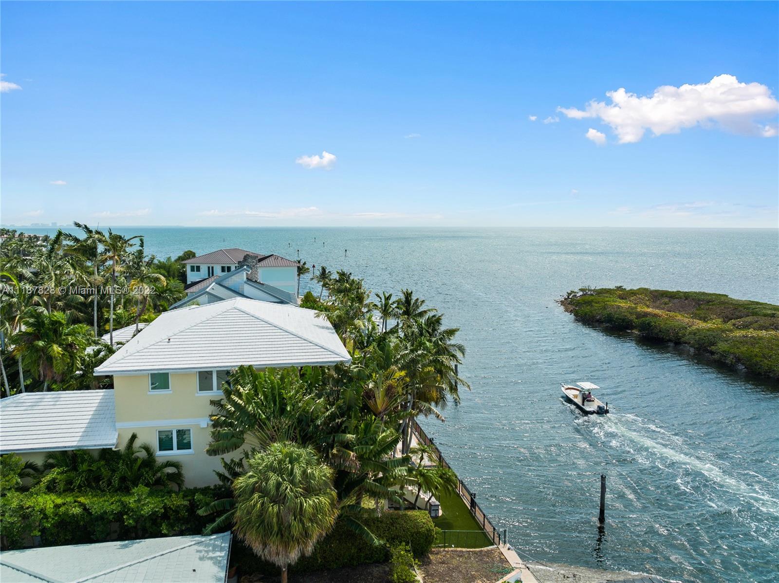 YOU CAN SEE FOREVER ! SELLER FINANCING IS AVAILABLE! WATERFRONT VILLA WITH INCREDIBLE OCEAN VIEWS from all Stories of the house.Direct Ocean Access and No Bridges to Bay.100 Foot Seawall. Saltwater Heated Pool. 3rd house from point. All impact Glass. 2 Car garage. Incredible Home Theater. Ground Floor Entertainment room off the pool with incredible full bar. 22 foot ceilings in the living room. marble and hardwood floors. Fully modern kitchen. House has lots of balconies and terraces and lots of light.Hi ceilings in bedrooms.Watch the sunrise and sunset.Master bedroom suite complete with landing area perfect for office and stunning bathroom with ocean views and a large covered terrace perfect to wake up to and start your day with the ocean sunrise from your bedroom.