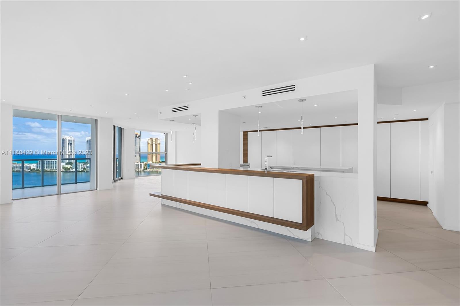 Designer renovated modern and spacious 3 bedroom, 3 baths,  with a contemporary open den.  Complete Impact throughout. Open island kitchen with state of the art appliances.  Spectacular views of Bay, Ocean and Sunny Isles.Concierge service w/country club amenities. BRING OFFERS. Easy to show.