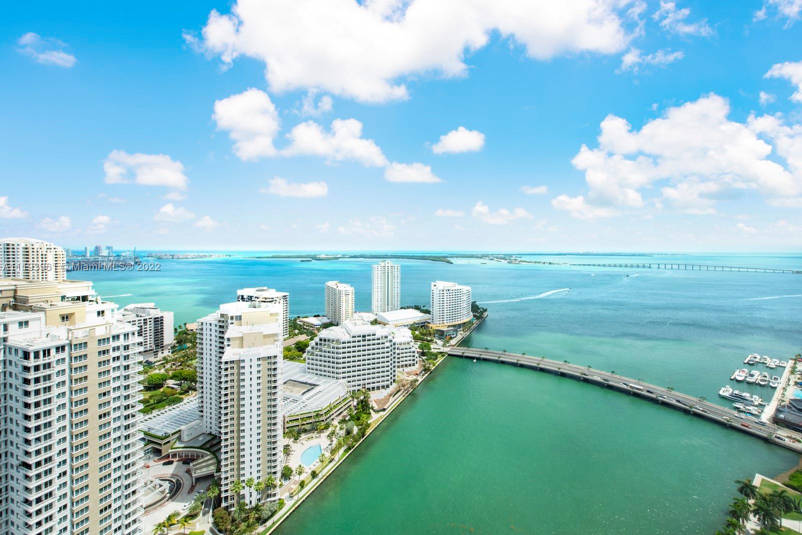 Tastefully remodeled 2BR/2BA + Den, high floor unit at the Icon Brickell. Top quality, high end finishes that compliment the views of the beautiful waters of Biscayne Bay meeting the mouth of the Miami River. Take in the pristine colored waters & impressive city skylines through the floor to ceiling impact windows with North East exposure. Includes a balcony that runs the length of the unit, electric shades, over 100 recessed, high quality lights and gorgeous chandeliers. Top of the line appliances with an open kitchen layout overlooking the living area. Lovely Marble throughout, including bathrooms that will make getting ready for a night out on town a pleasure. Large walk in closets built out for efficiency, there is too much to list. I didn't even mention the amazing amenities of Icon!