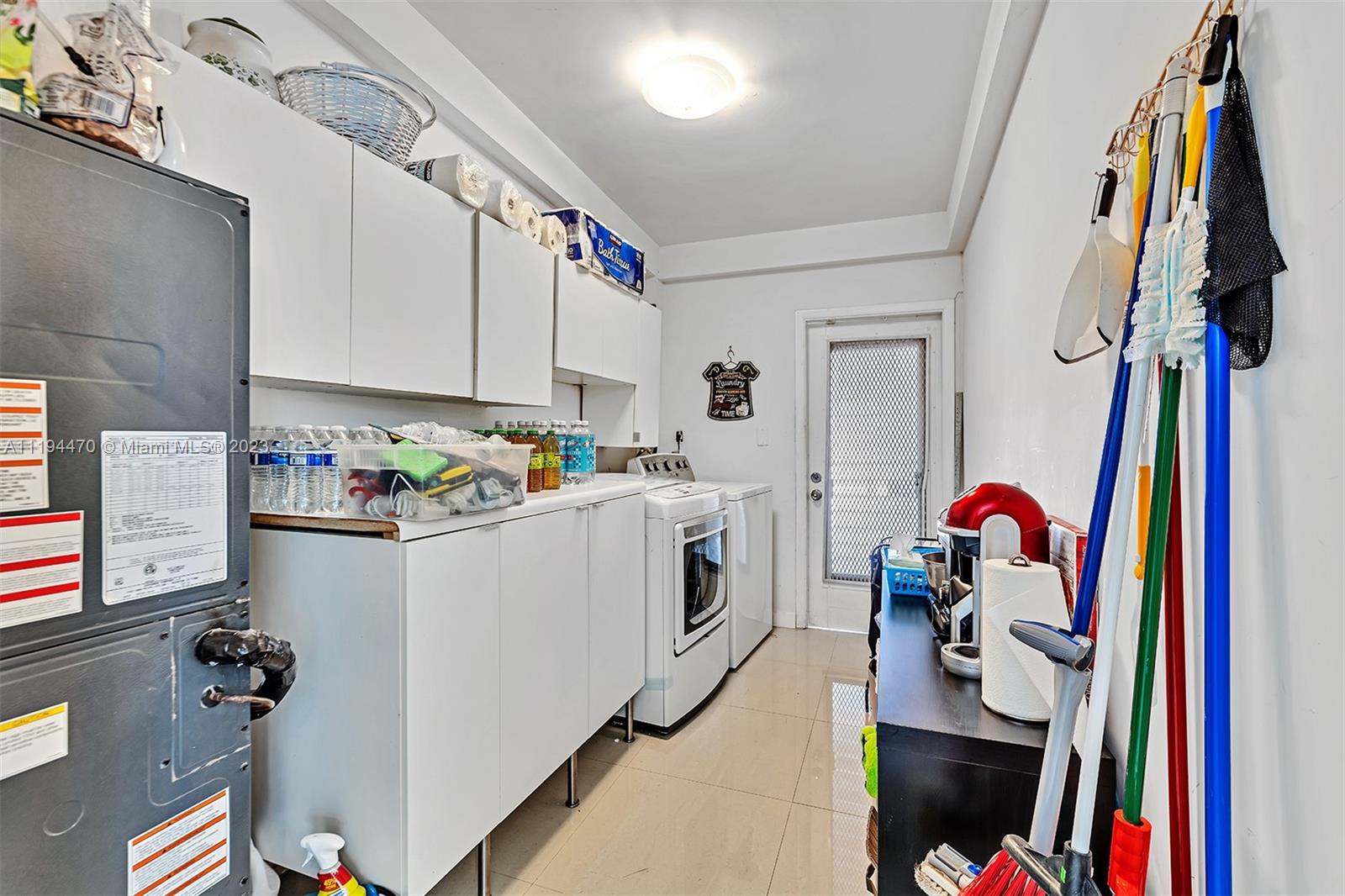 SEPARATE AND SPACIOUS LAUNDRY ROOM. FULL SIZE WASHER AND DRYER.