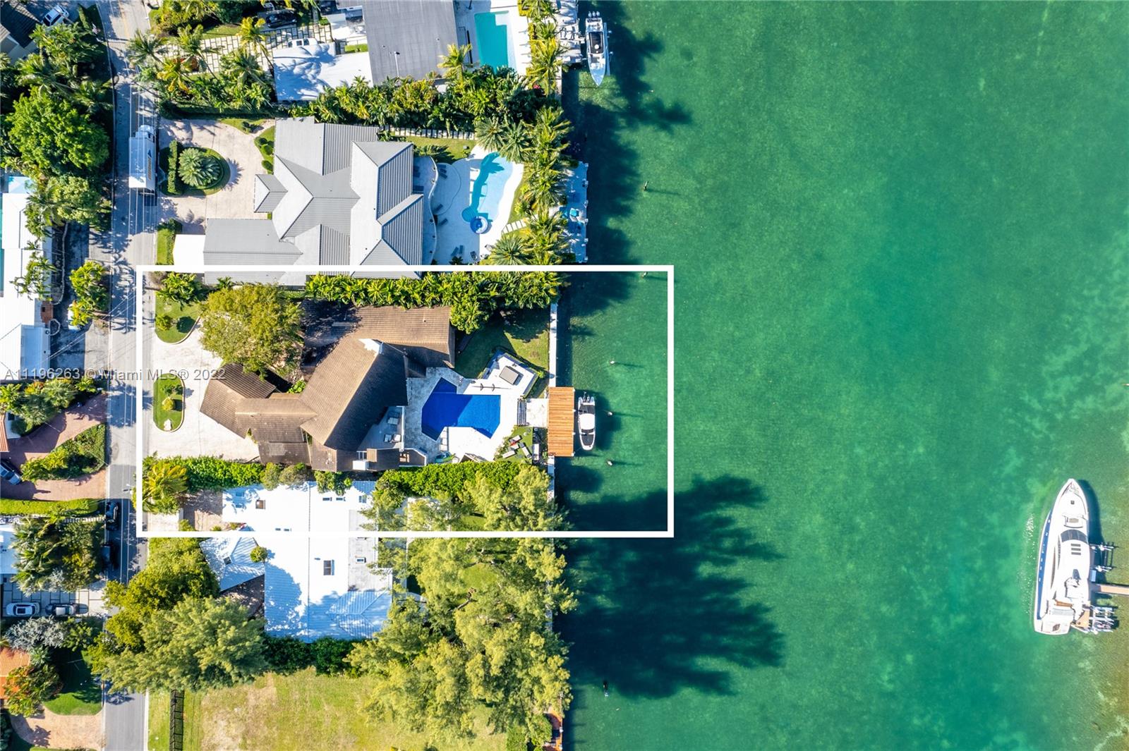 This architecturally unique 6,600 SF home was designed by Barry Sugarman and sits on an oversized 18,400 SF lot with 92 LF on the water. It has soaring 25’ ceilings, large living spaces, massive terraces, and stunning views of a wide waterway and Indian Creek Island. It also has a home theater, office, gym, playroom, and large eat in kitchen that opens up to a patio. The primary bedroom is on the ground floor and features his and hers baths. This beautiful home has impact windows, a two car garage, and a brand new, oversized dock. It’s the perfect family home on a cul-de-sac, and minutes from the ocean, Bal Harbour Shops, and restaurants.