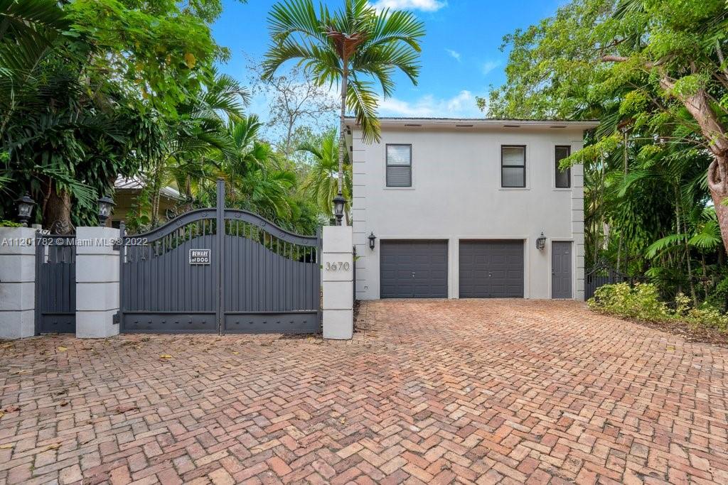 Single Family Home in the heart of Coconut Grove. This is a must see contemporary beauty on a lushly shaded lot w/ approximately total Living area of 4,241 Sq. Ft. (for both houses per owner's information).  Two story 4 beds/3.5 baths on main structure + an adjacent 2/1.5 guest-in law/guess facility. This gem has one bedroom suite with his bathroom on the first floor and laundry room is convenient located on the 2nd floor. Natural wood floors on 2nd floor rooms & marble floors throughout. Ample well designed kitchen an ideal haven for cooking/entertaining lovers. The patio is great for family gatherings to enjoy the pool area and the open pit BBQ.  Property has new roof and Impact door & windows (done less than 2 years). Showing Wednesday June 22nd @12PM by appointment ONLY!!