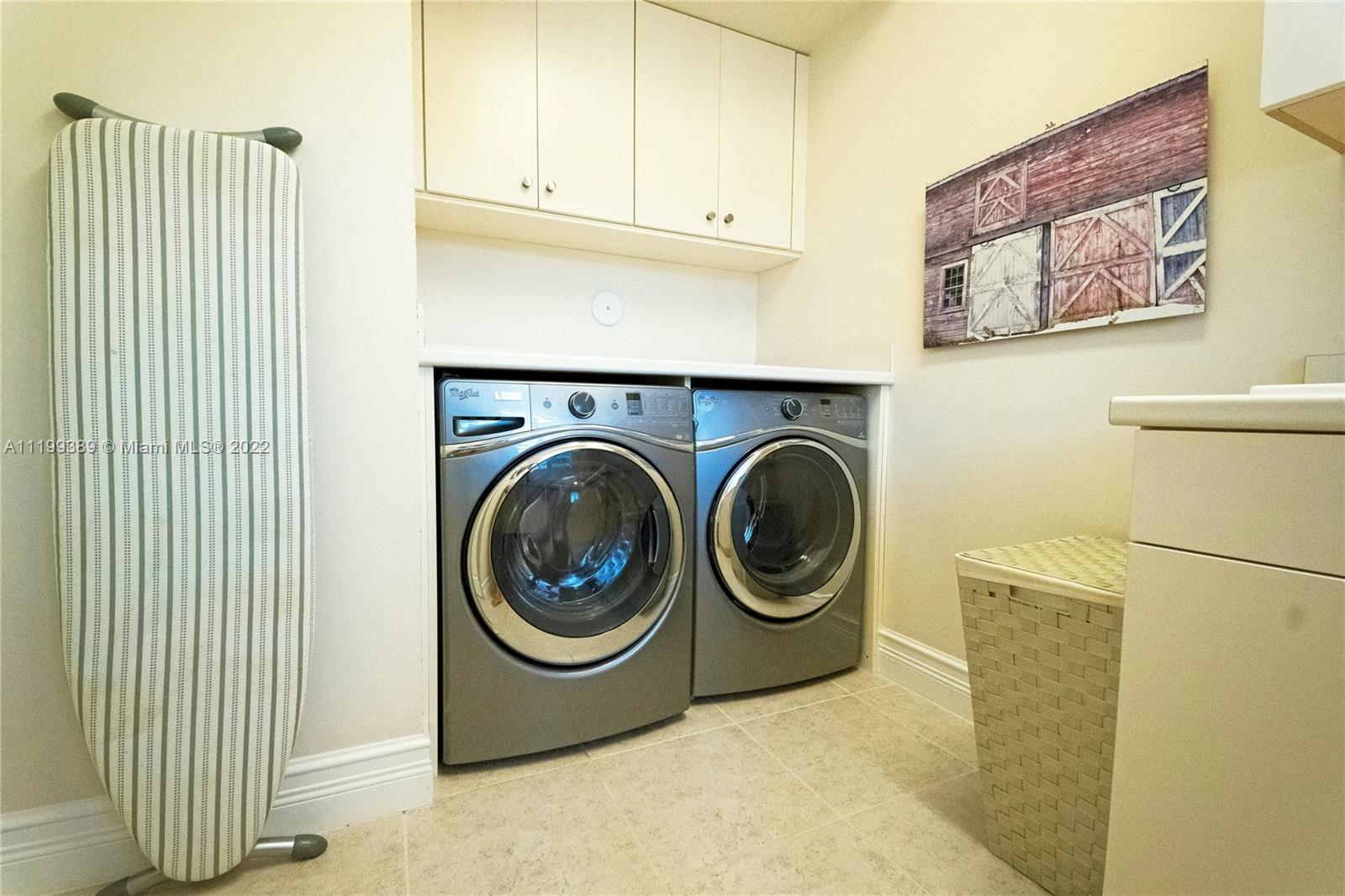 Laundry Room with sink and lots of cabinetry