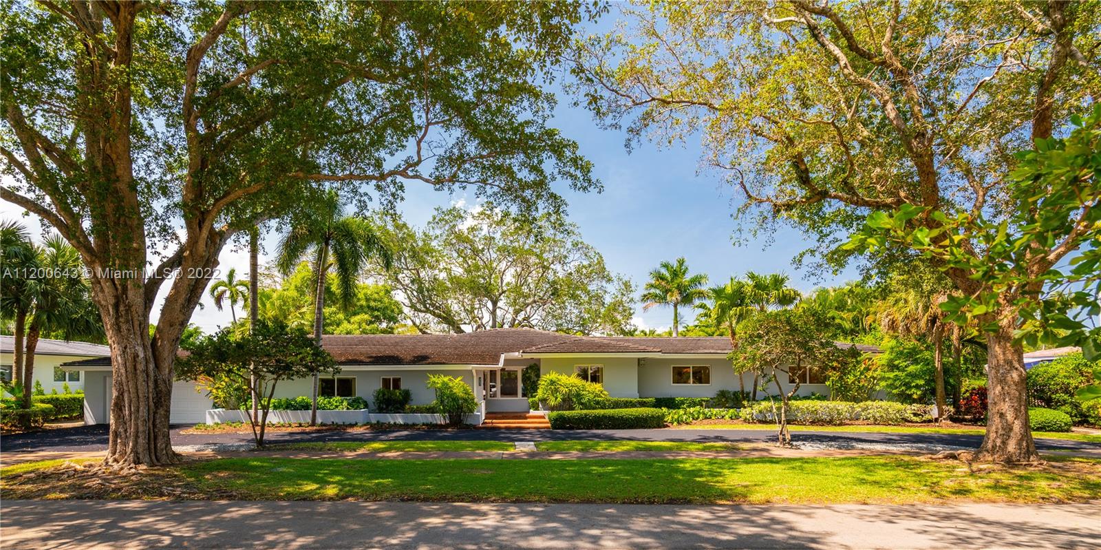 A treasured home in Coral Gables is now available for one lucky Buyer. Situated on a private, sun-dappled 18,750’ lot, this bright, one-story, 4 bedroom, 3.5 bath home is located on one of Coral Gables' finest streets, just 3 blocks from the historic French Village. The excellent floorplan graciously flows from one room to another and includes French doors lining the rear of the home. There is a sunny, eat-in kitchen with walk-in and butler’s pantry and features a large formal dining area with crown moldings throughout. The master suite and closet are sure to impress and, along with the family room, face an amazing oak-laden garden, deck and glamorous pool. The home is generator ready and features impact windows, tons of storage space and a 2-car garage. A Very Special Home.
