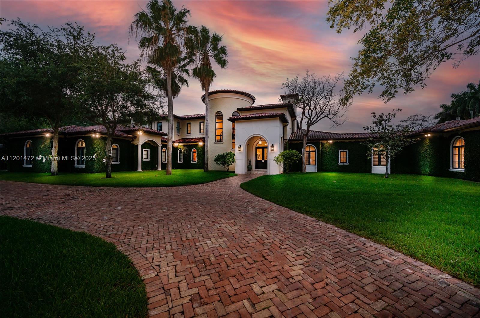 Nestled in a quiet no thru street is this magnificent custom-built estate in sought after Pinecrest. This home welcomes you with a double gated entrance and large Chicago brick driveway. Walk through the grand foyer and double doors which leads to a spectacular formal living rm with double height ceilings. Immense gourmet kitchen feat. gas stove and industrial fridge is a chefs dream. Lavish 1st floor master suite offers 2 walk-in closets, spa like bath w/ tub & shower w/ steam option. Oversized 2nd floor terrace w/ access from 4 upstairs bedrooms, which each have their own bath rm and walk-in closet. Resort style backyard w/summer kitchen, covered terrace and pool. Other Features: elevator, full home generator & security system, wine cellar, & 3 car gar w/ room for lifts.