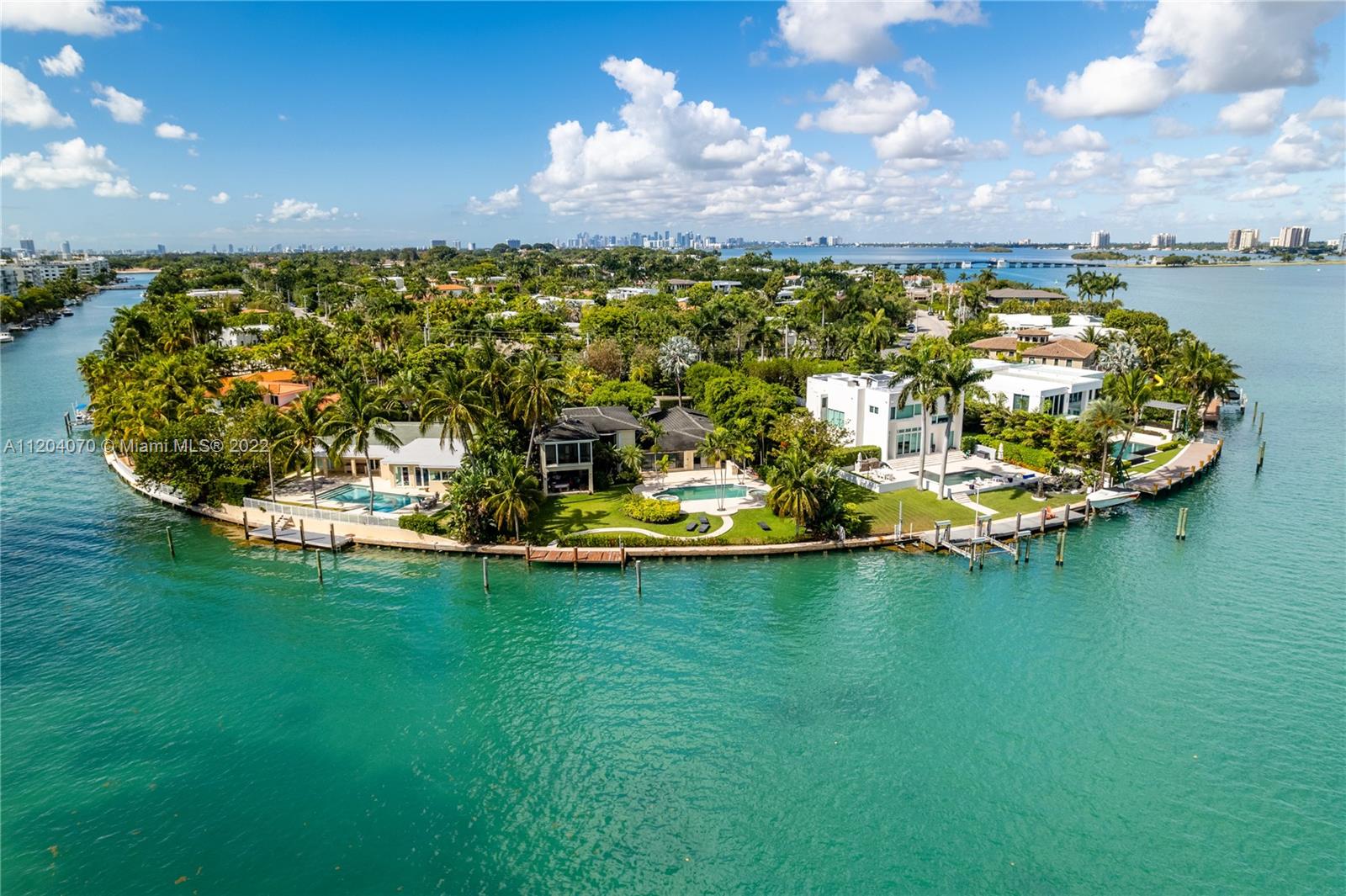 This extraordinary estate sits on a 20,691 square-foot pie-shaped lot. It has the most expansive open bay views in Bay Harbor and boasts 120 linear feet of breathtaking waterfrontage that overlooks Biscayne Bay and the Sunny Isles skyline. One of the largest lots in Bay Harbor, this home’s floor to ceiling windows offer beautiful natural light all day as a result of its northern exposure. Renovate this home to perfection or build your dream home in Bay Harbor.