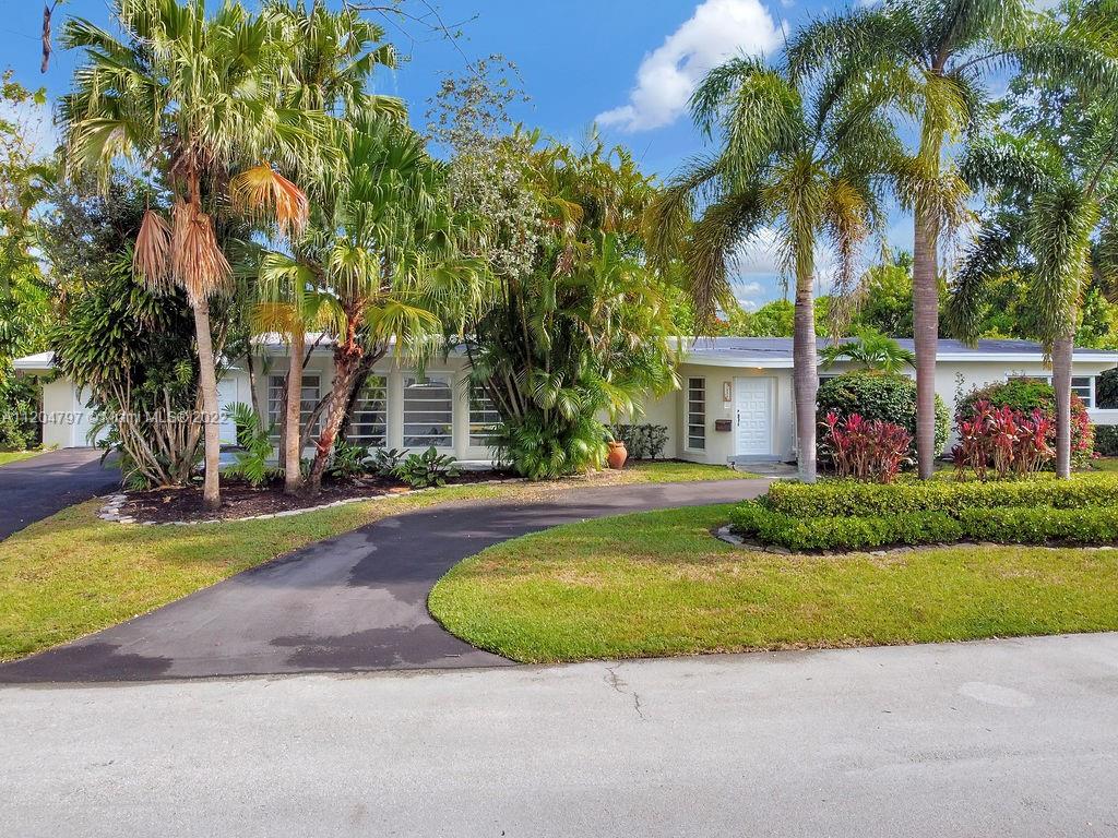 Come and tour this gorgeous Pinecrest gem! Exceptional opportunity with the perfect layout and ready to be made into your dream 2022 home. Tropical single story estate combines indoor-outdoor living to create light, airy spaces. Many details have already been completed such as: Roof was done in 2019 along with Termite tenting. Over sized 2 car garage updated with hurricane-impact garage door was installed in 2022. Both driveways were freshly paved in 2022. A/C is from 2018. Pool interior was resurfaced in 2020 along with new pool screens. Make this your forever home.