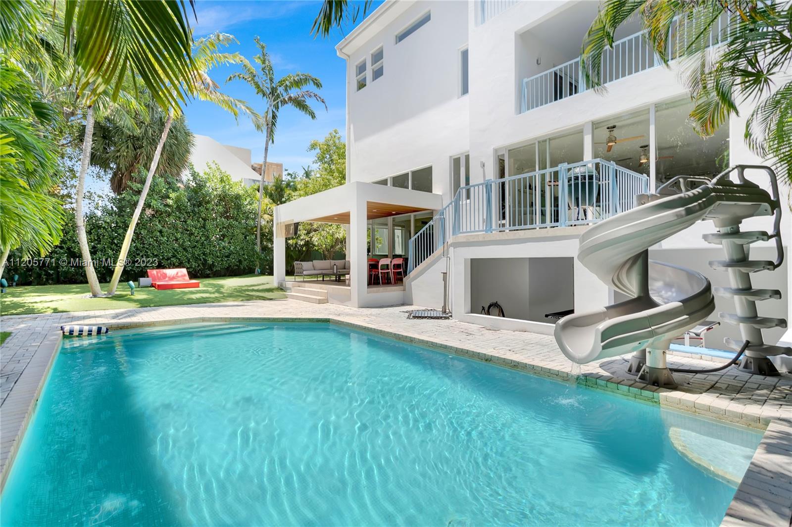 Beautiful home in coveted Harbor Dr. with 4,678 sf adjusted living area set on an oversized 8,292 sf lot. This house features 6 bedrooms, 6 baths and plenty of spaces to live, work and entertain; it is the perfect family home. Double height in living room and ample natural light throughout. Very well-equipped kitchen with top-of-the-line appliances including Sub-Zero refrigerator and large wine cooler. Enjoy Miami sunsets from the roof terrace or relax by the pool on its covered porch and large green area. Closed 2-car garage plus 2 space covered parking with electric vehicle charging station, and extra parking space in the circular driveway.