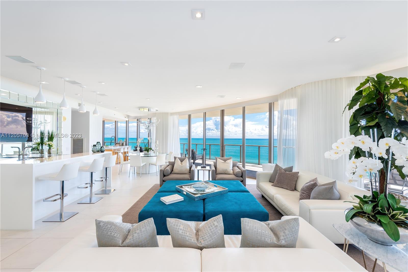 AUCTION: BID 8-14 JUNE. Currently Listed for $9.95M. No Reserve. Showings Daily by Appointment.  This luxurious Florida condo has unbeatable 180-degree direct ocean views with a huge rounded terrace to match.  The bright and modern interior has high ceilings, floor-to-ceiling windows throughout, and an open floor plan perfect for entertaining. The kitchen has a large island with beach views, tons of storage, and high-end appliances.   The primary suite has access to the balcony, tons of space, and a spa-like bathroom.  Owners have access to all of the St. Regis Hotel amenities like the 24hr concierge, gym and spa, on-site restaurants, and, of course, the beach and the three pools. Luxury beach living is waiting for you at this premier Florida property!