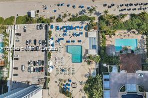 AERIAL VIEW DIRECT ON-THE-SAND , ALL DAY , FULL SUNNY POOLDECK WITH EXCLUSIVE PRIVATE ACCESS RESIDENTIAL LOCATION TO BEACH AND OCEAN