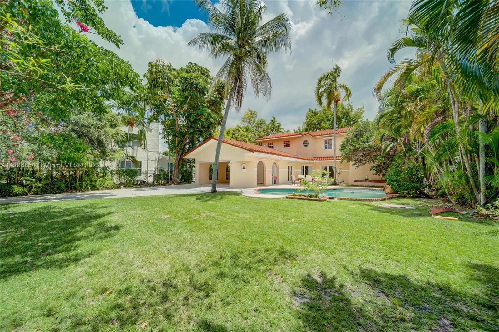 Beautiful Spanish Style two-story home in “The Roads” Area of Miami, featuring 5 bedrooms and 3.5 bathrooms, this property sits on an over-sized lot of almost 10,000 sq/ft and is surrounded by mature large fruit trees throughout. Renovated areas in the kitchen, Master Bedroom and Master Bathroom.  Double car garage plus bonus room and a Large pool with Partly covered terrace. Privacy wall on the street creates a completely private oasis for the homeowner.  Beautiful original wood floors upstairs.  Minutes from Downtown Miami, Brickell, Coconut Grove, Coral Gables, Key Biscayne and Miami Beach. Please call listing agent for showings.